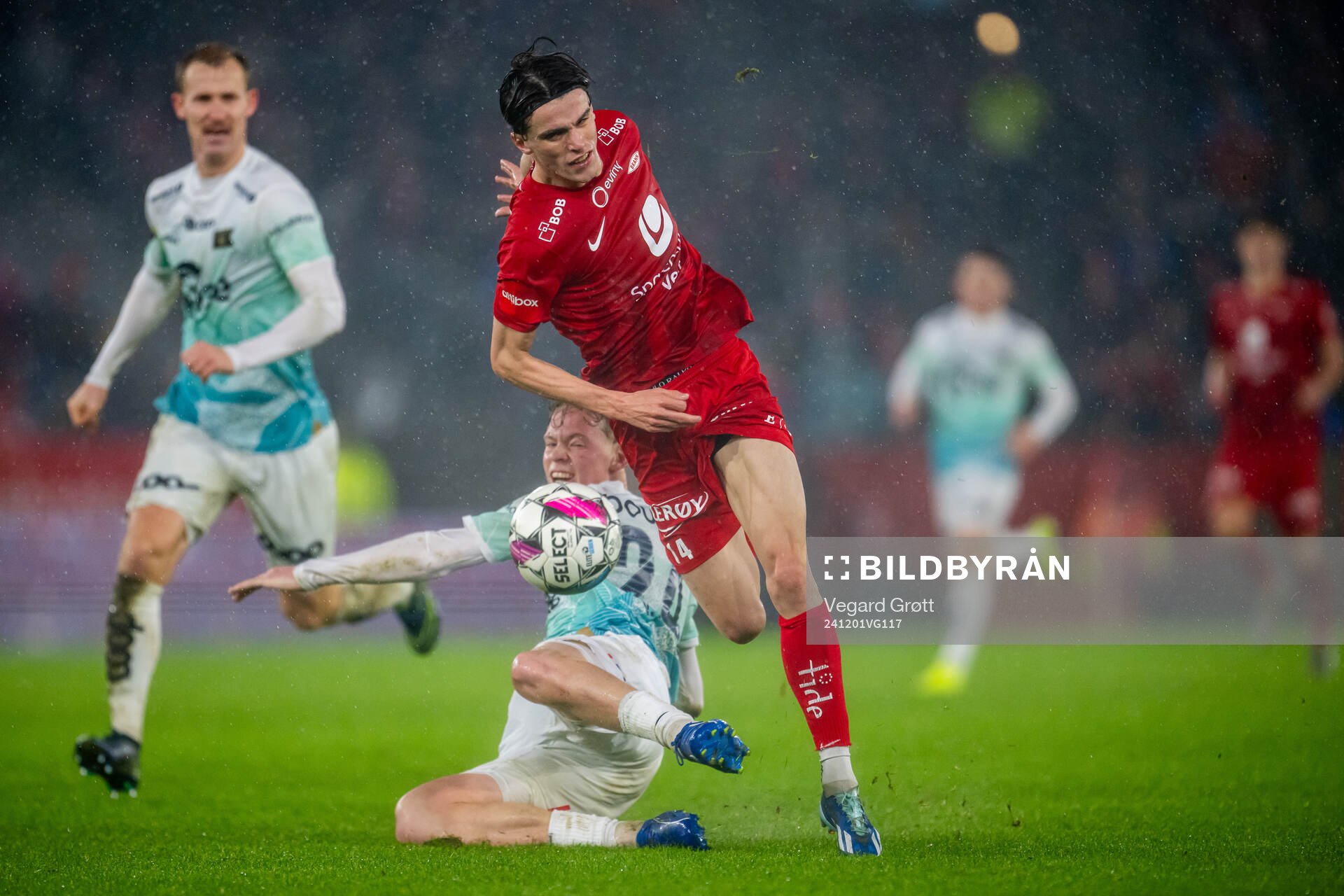 Vetle Auklend of Viking tackles Ulrik Mathisen of Brann to