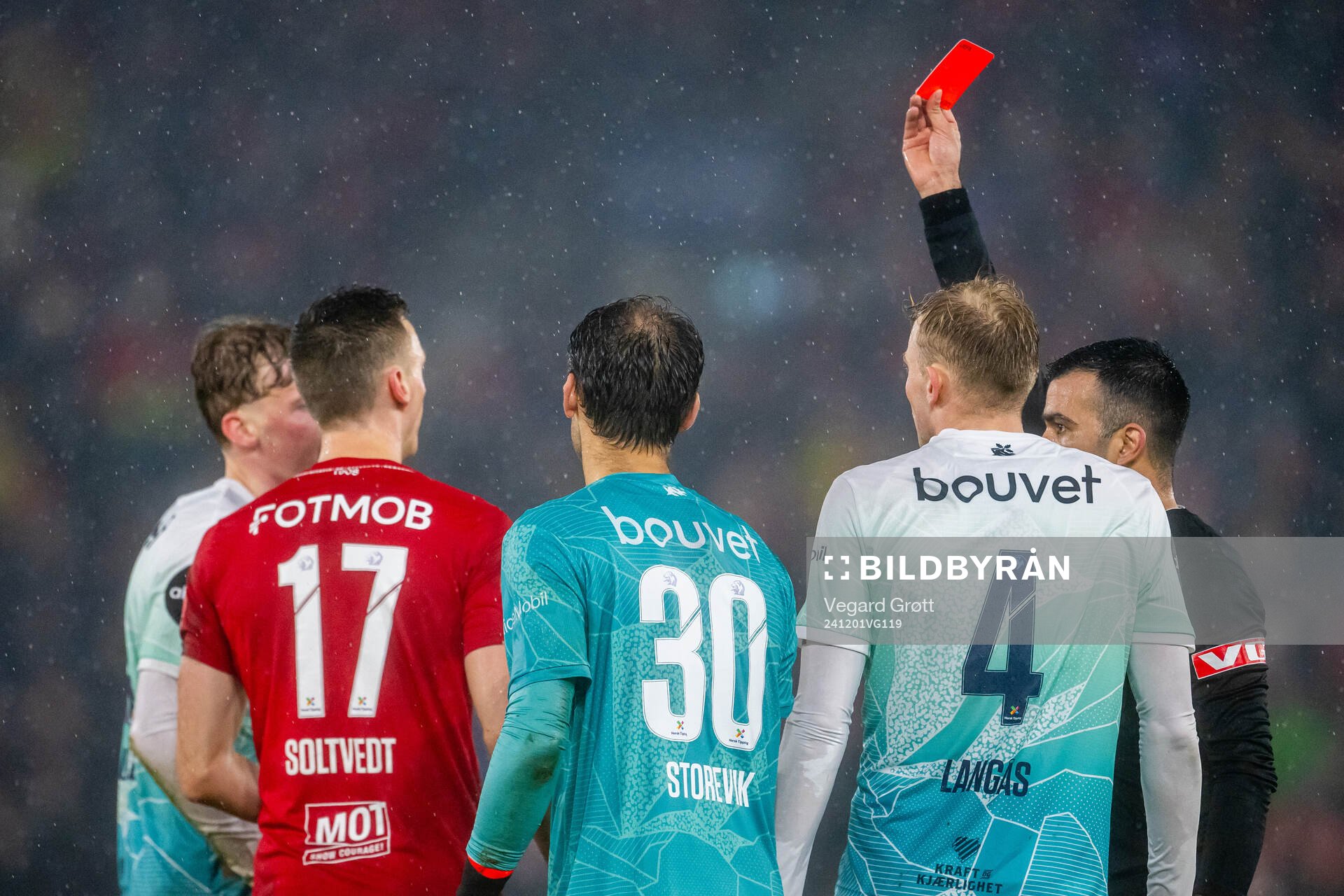Referee Rohit Saggi gives a red card to Vetle Auklend of