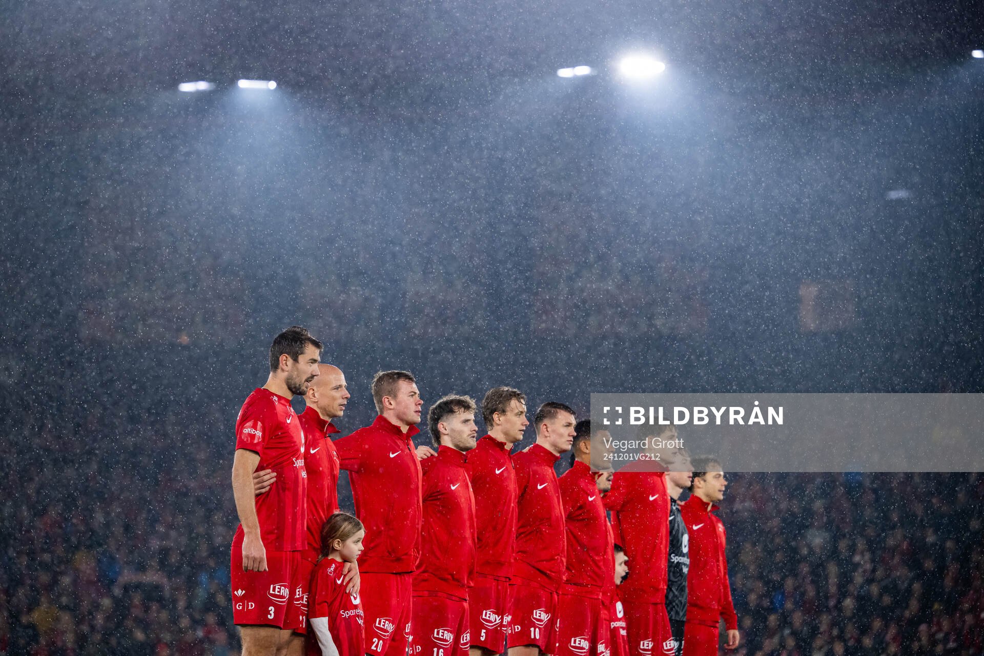 Fredrik Pallesen Knudsen, Ruben Kristiansen, Aune Heggebø, Ole Didrik Blomberg, Sakarias Opsahl, Emil Kornvig, Japhet Sery Larsen, goalkeeper Eirik Holmen Johansen, goalkeeper Mathias Dyngeland, Felix Horn Myhre and players of Brann line up during «Nystemten» ahead of the Eliteserien football match between Brann and Viking on December 1, 2024 in Bergen.