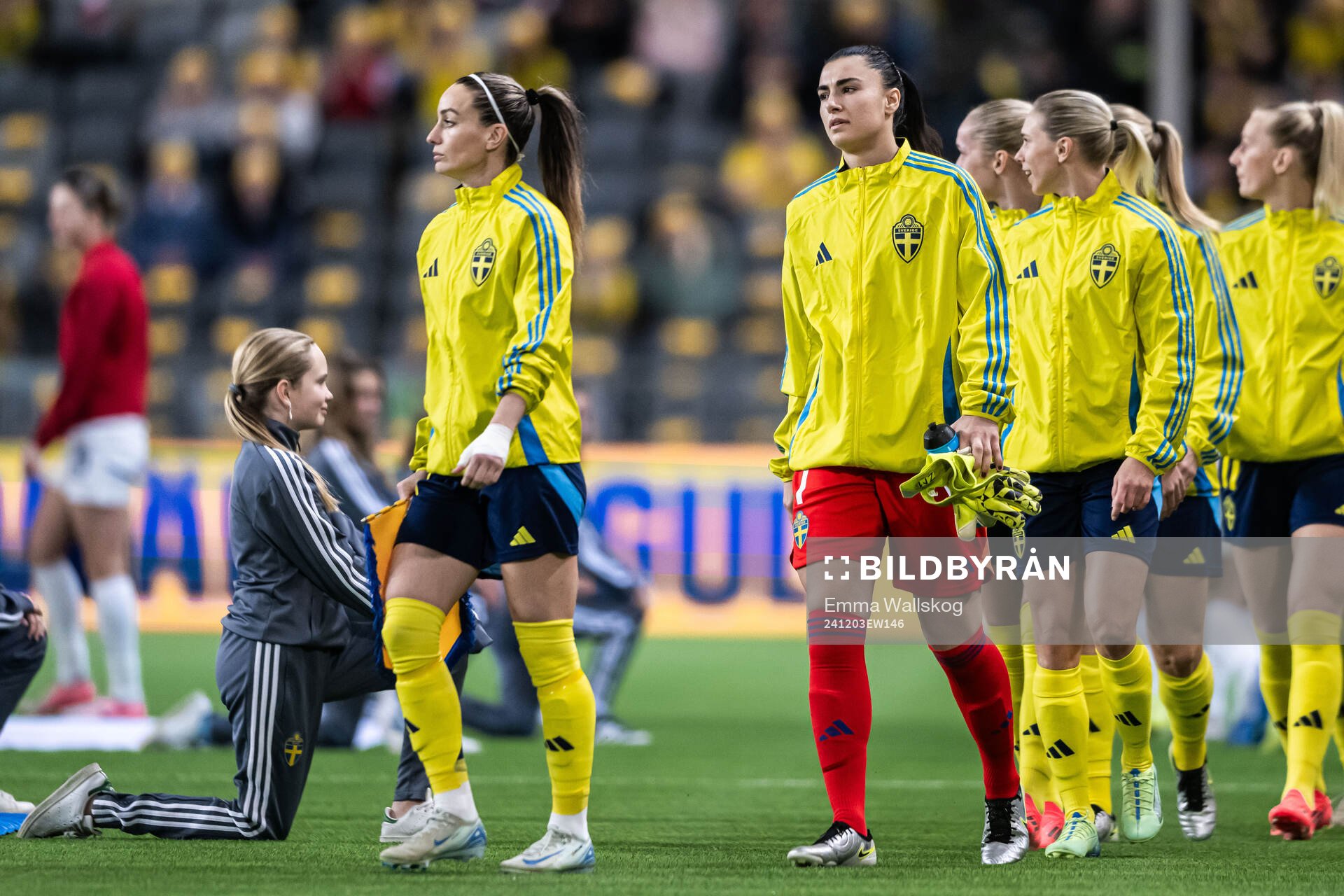 Kosovare Asllani and goalkeeper Zecira Musovic of Sweden