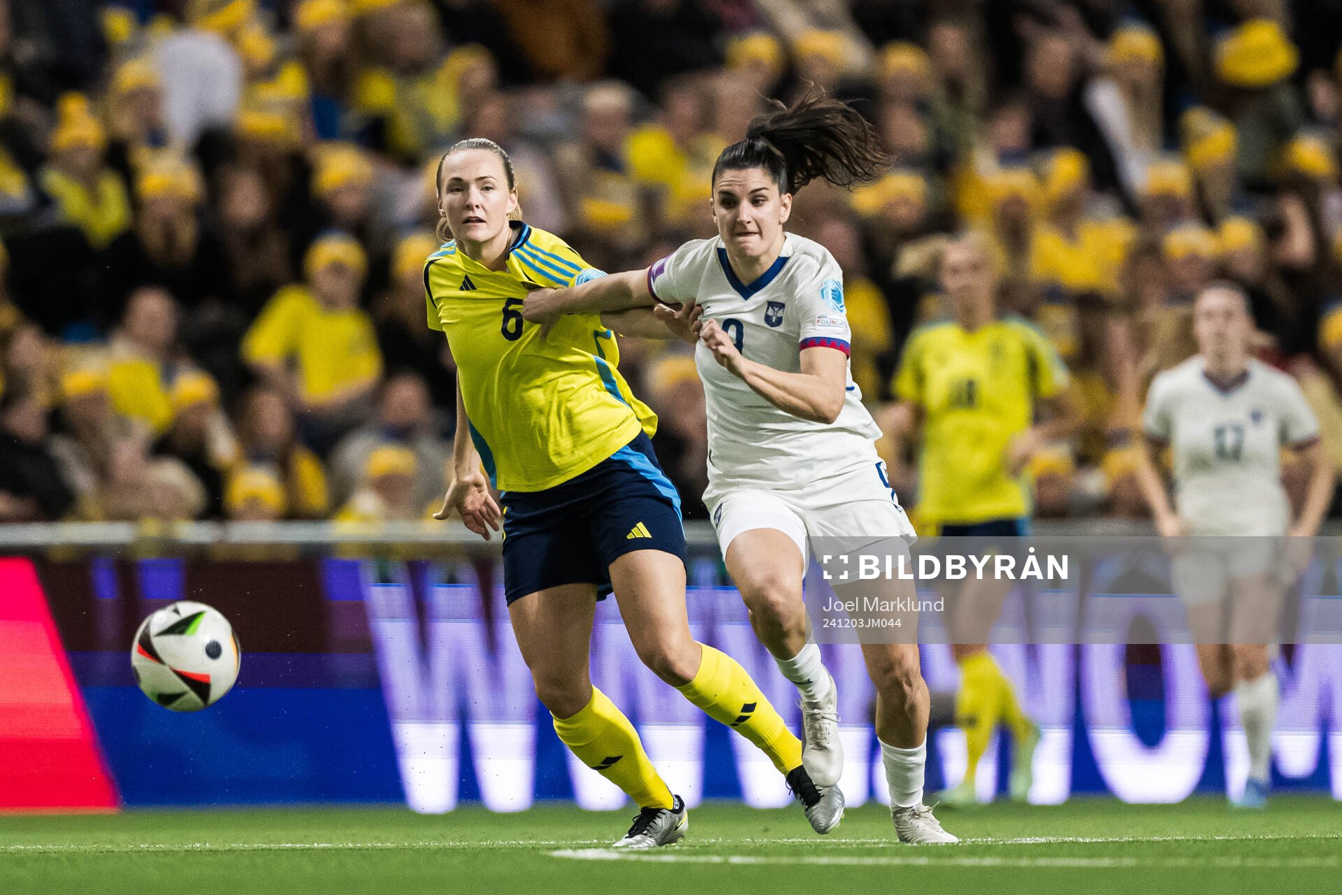 Magdalena Eriksson of Sweden and Jovana Damnjanovic of Serbia during the UEFA Women's Euro Qualifier play-off football match between Sweden and Serbia on December 3, 2024 in Stockholm.