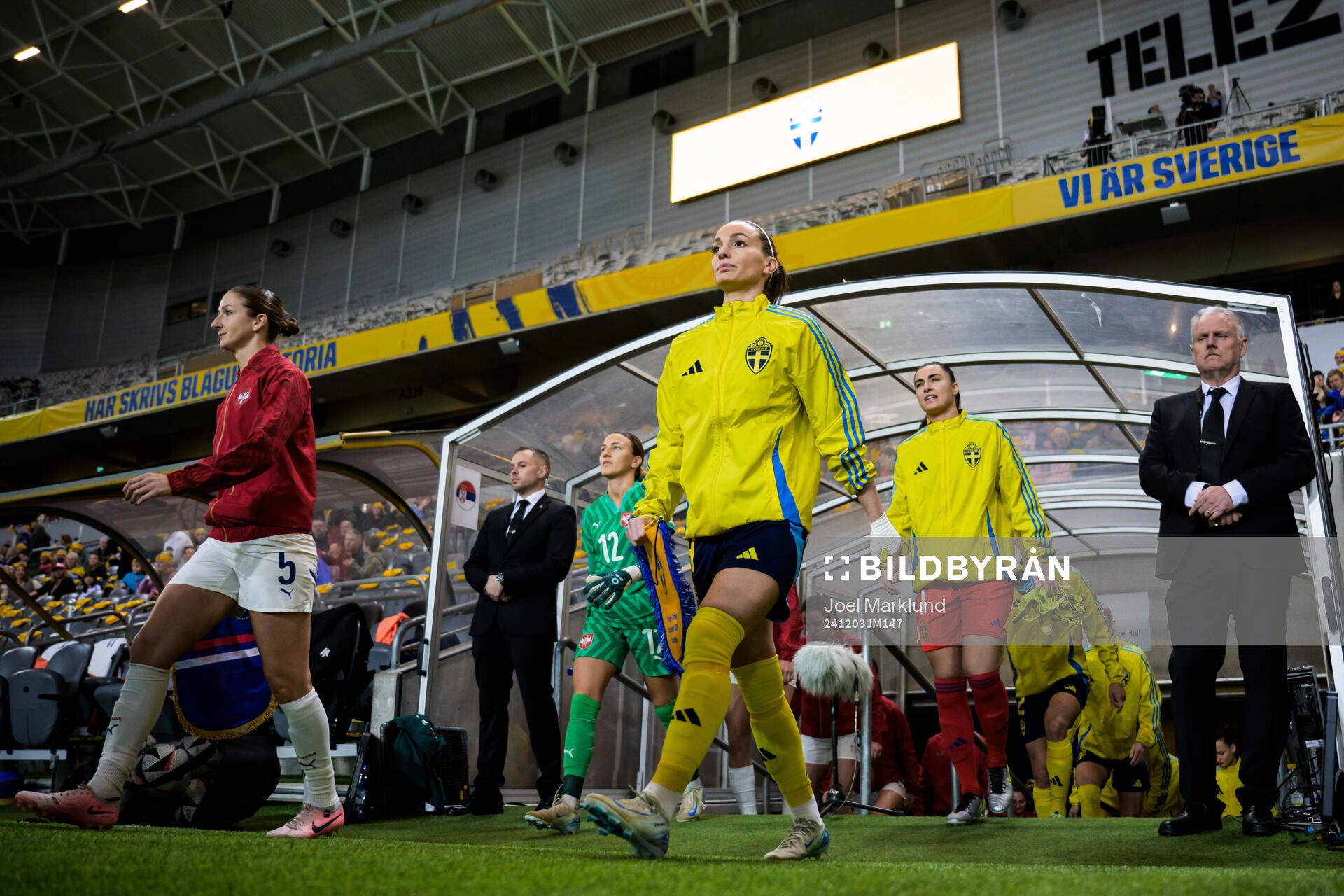 Kosovare Asllani and goalkeeper Zecira Musovic of Sweden