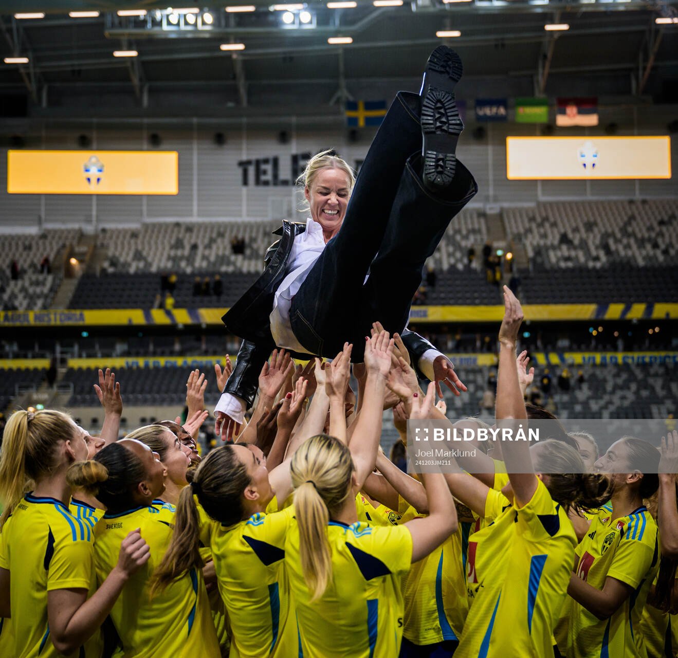 Players of Sweden throw Caroline Seger in the air