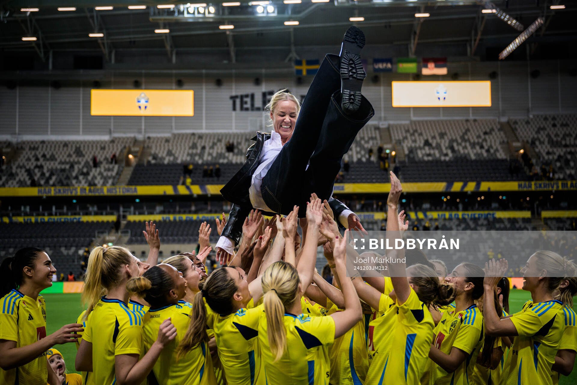 Players of Sweden throw Caroline Seger in the air during a ceremony to honor her career after the UEFA Women's Euro Qualifier play-off football match between Sweden and Serbia on December 3, 2024 in Stockholm.
