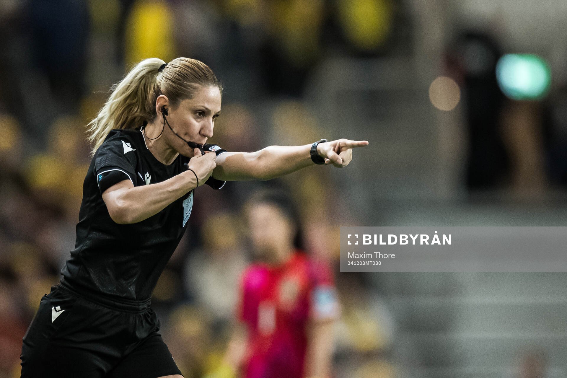 Referee Eleni Antoniou point for penalty