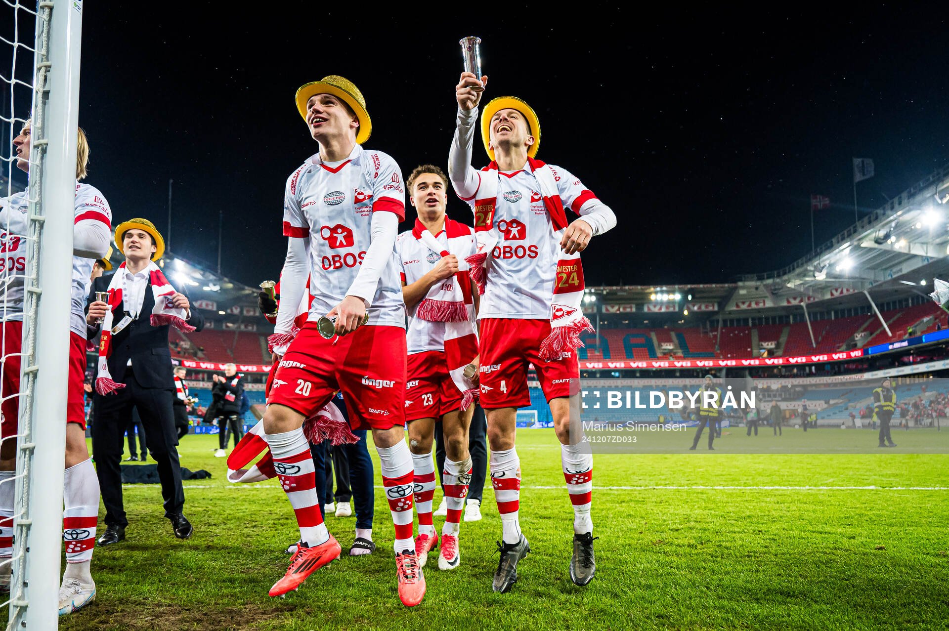 Jeppe Kjær Jensen, Henrik Skogvold and Stian Stray Molde of Fredrikstad celebrates with the trophy after the cup final match between Fredrikstad and Molde on December 7, 2024 in Oslo.