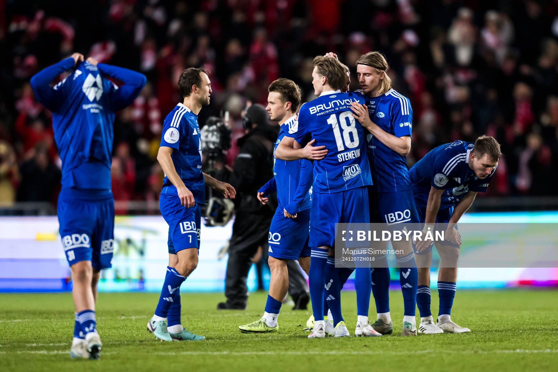 Players of Molde look dejected