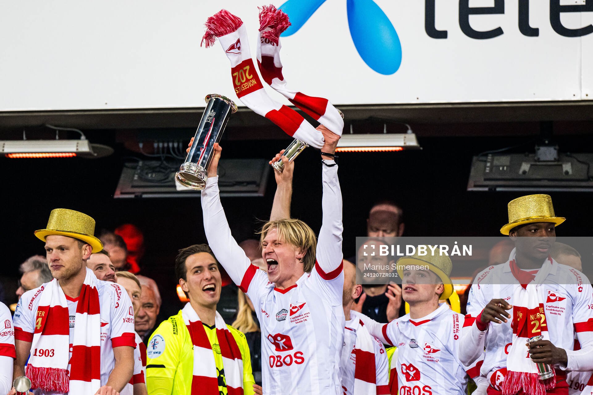 Daniel Fritz Eid of Fredrikstad celebrates with the trophy