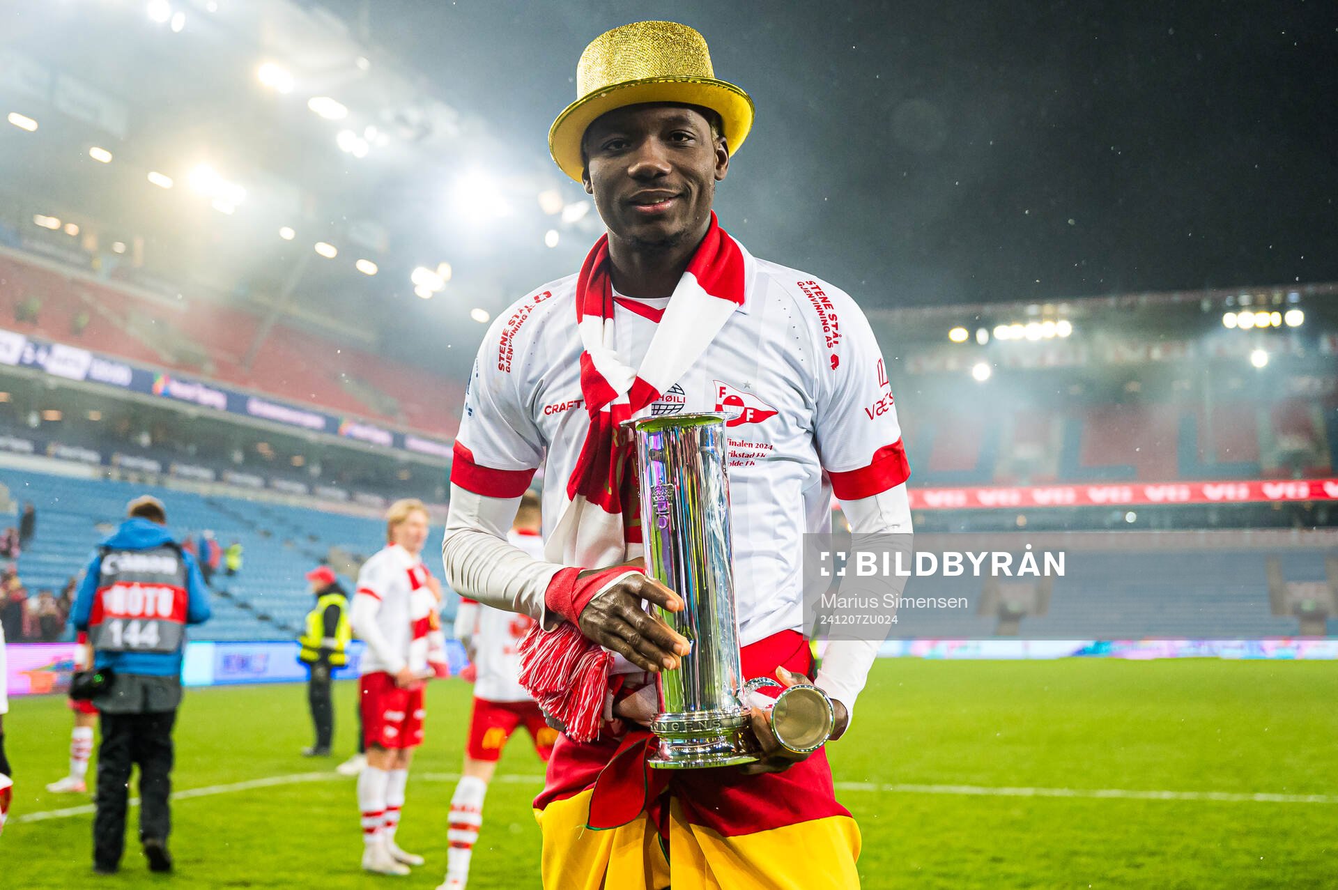 Maxwell Woledzi of Fredrikstad celebrates with the trophy