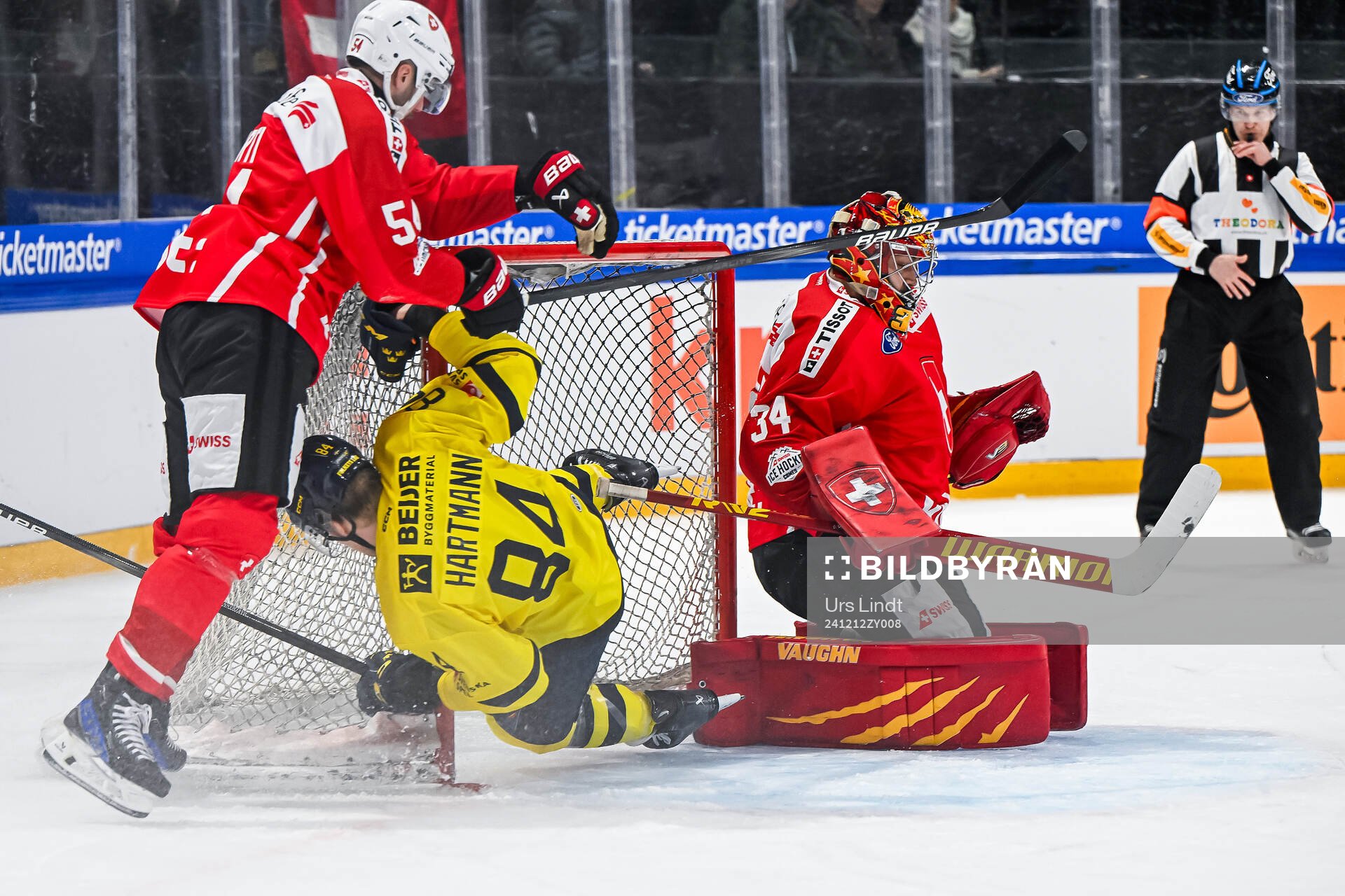Christian Marti and goaltender Stephane Charlin of