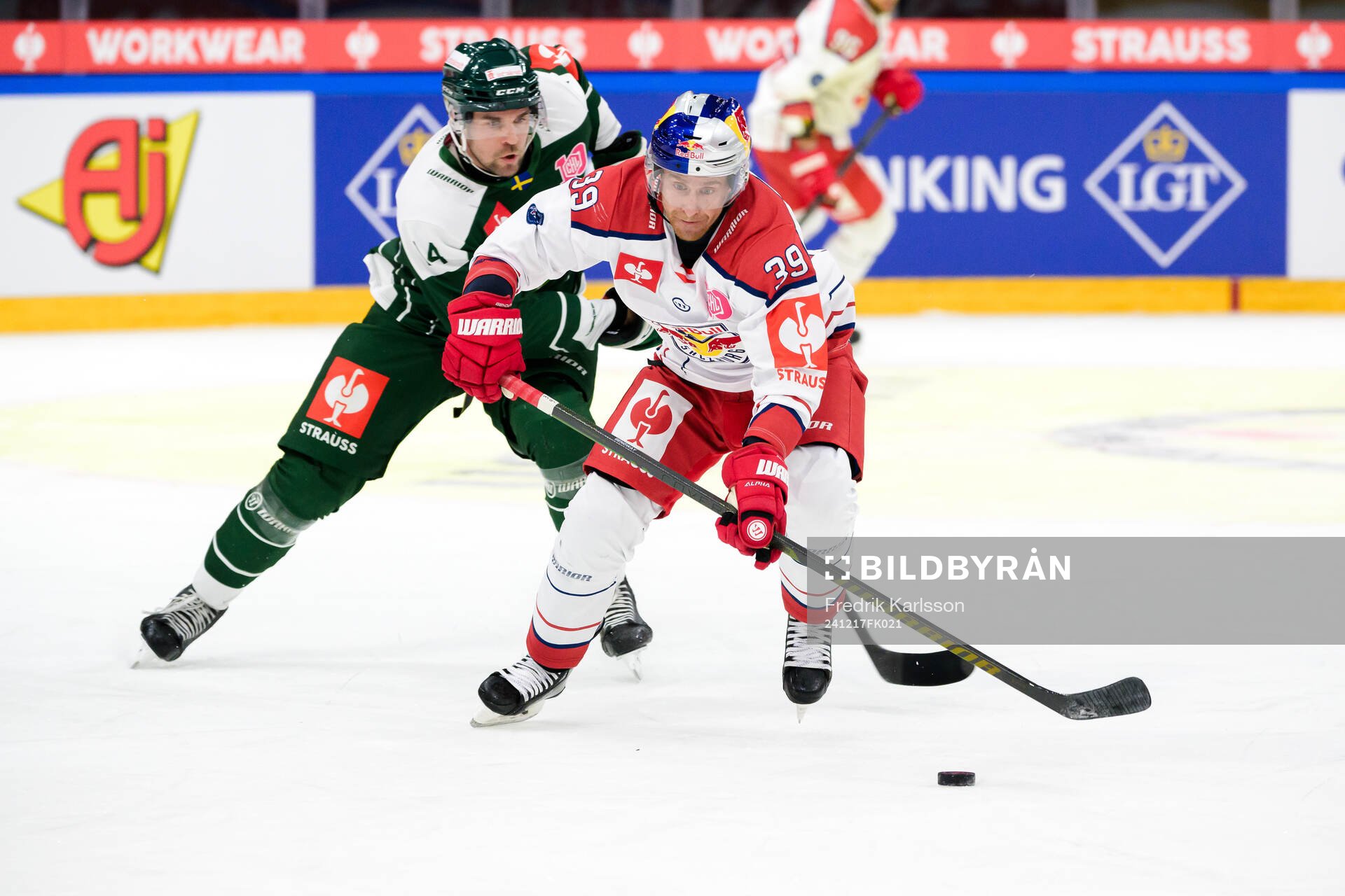 Henrik Björklund of Färjestad and Chay Genoway of EC Red