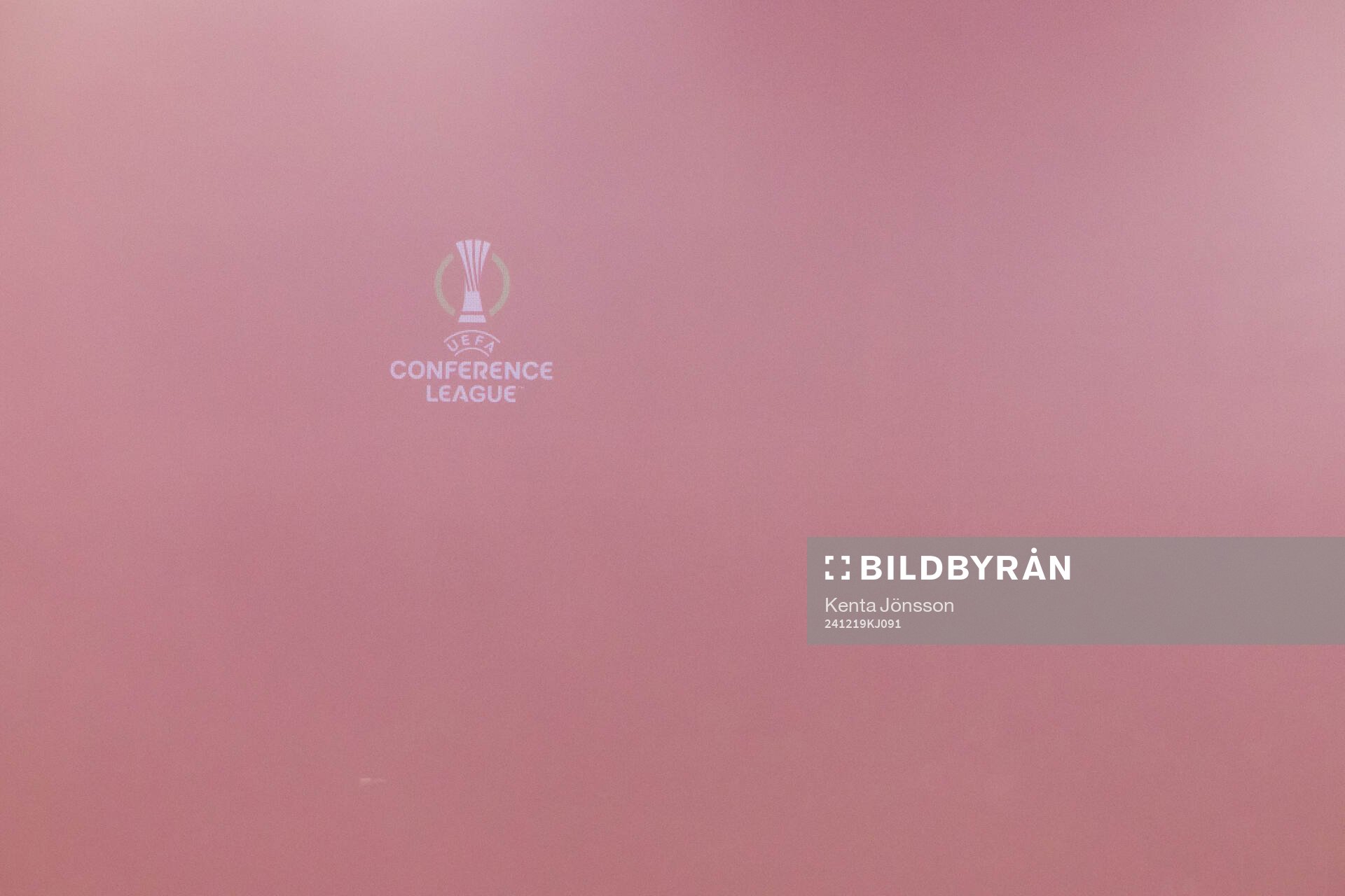 The logotype of UEFA Conference League is visible through