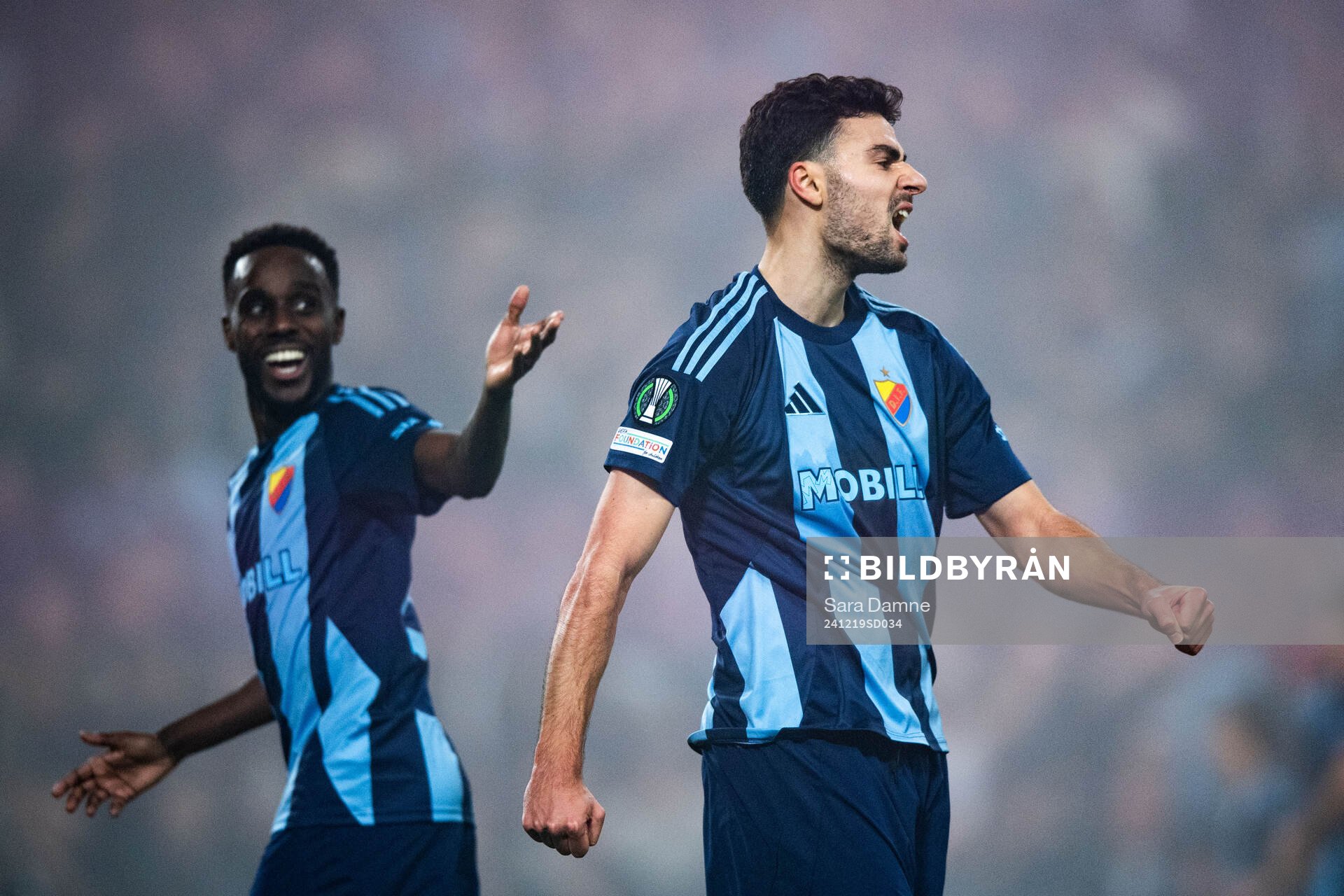 Tokmac Nguen and Deniz Hummet of Djurgården celebrate after 3-1 by Patric Åslund (not pictured) during the UEFA Conference League match between Djurgården and Legia Warszawa on December 19, 2024 in Stockholm.