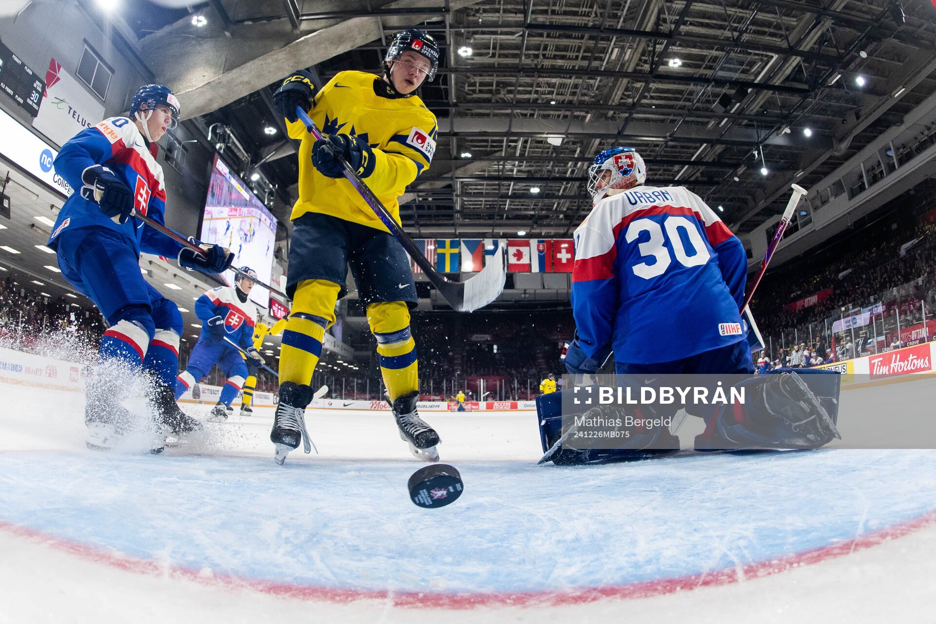 Isac Hedqvist of Sweden and goaltender Samuel Urban of