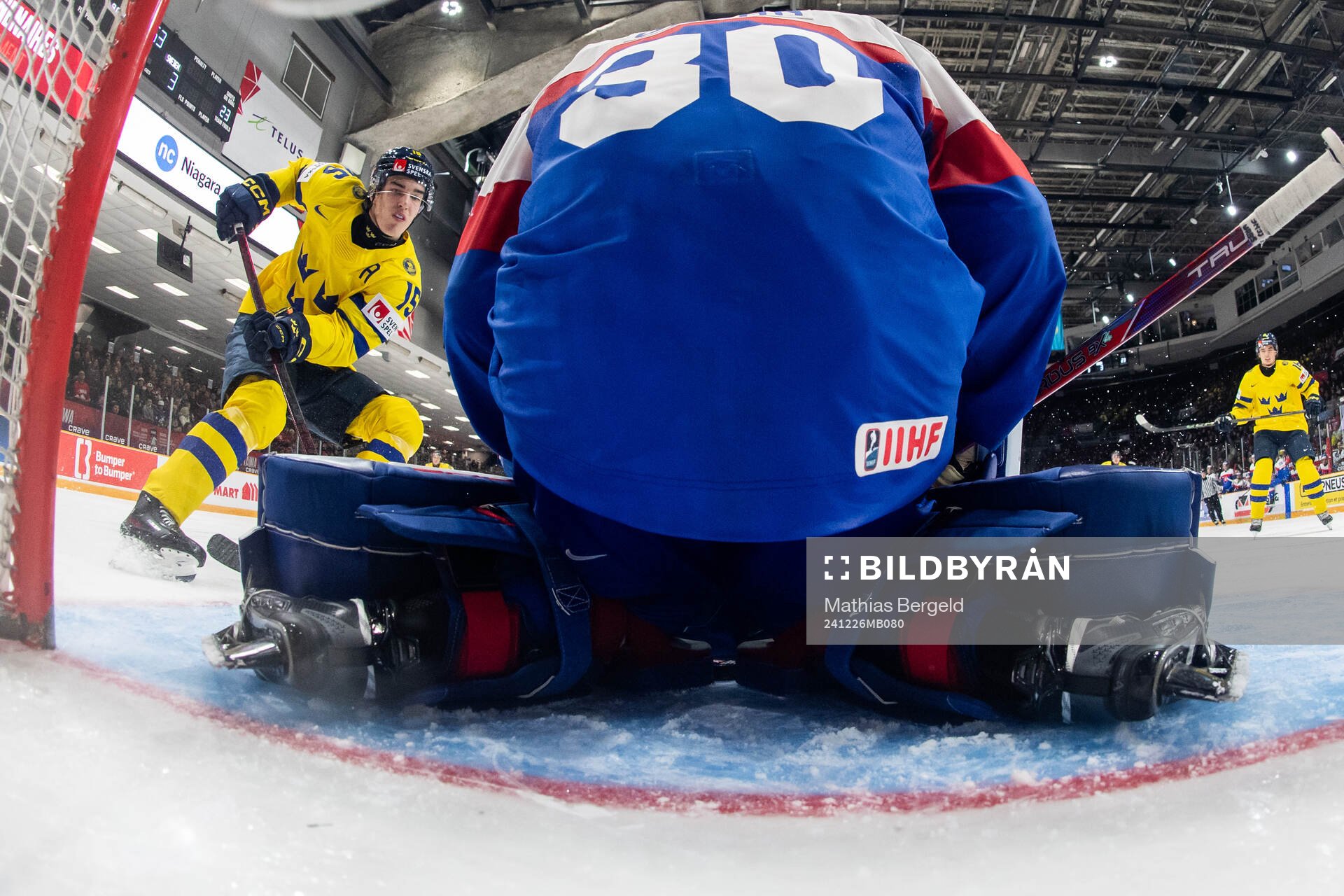 David Edstrom of Sweden and goaltender Samuel Urban of