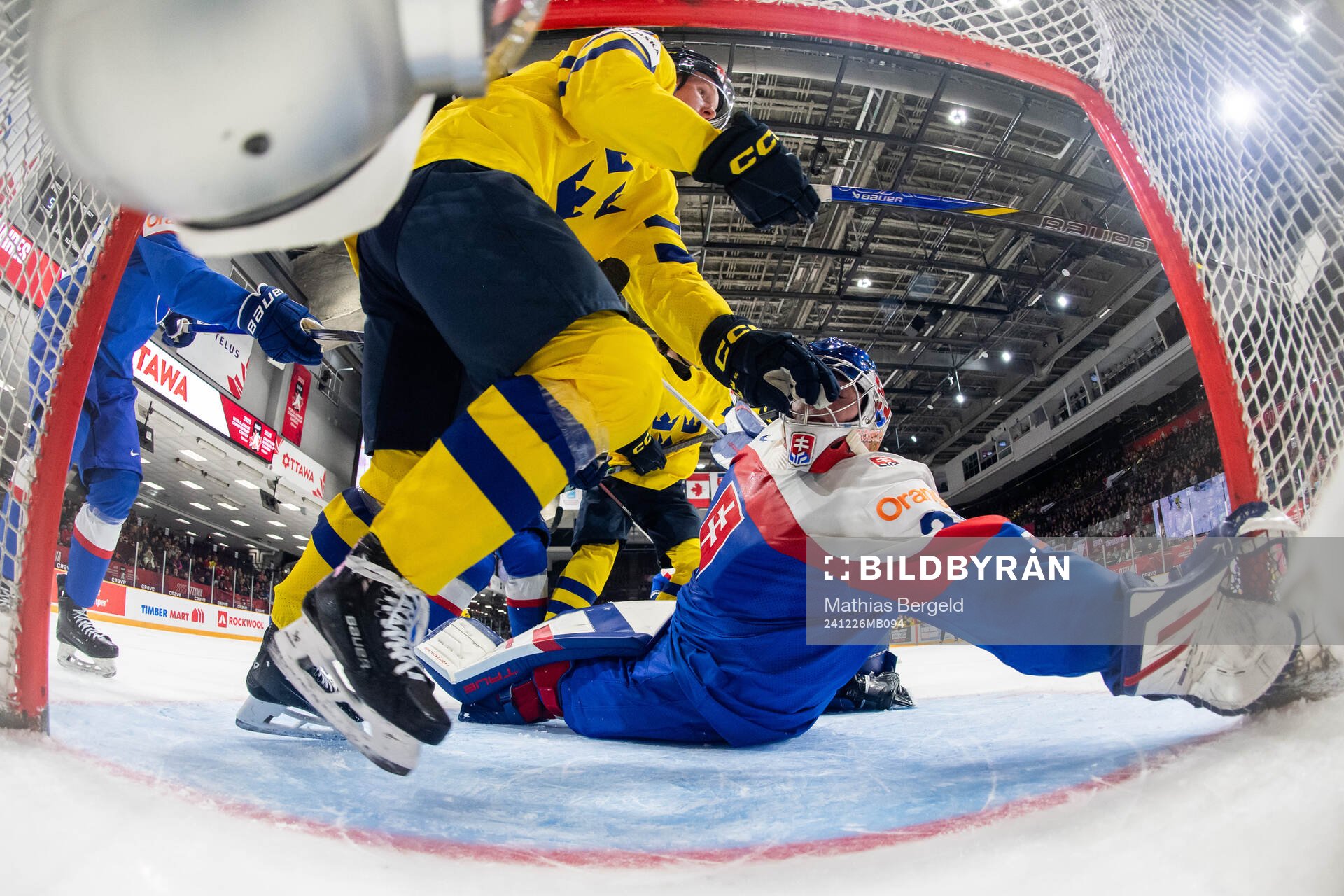 Otto Stenberg of Sweden and goaltender Samuel Urban of