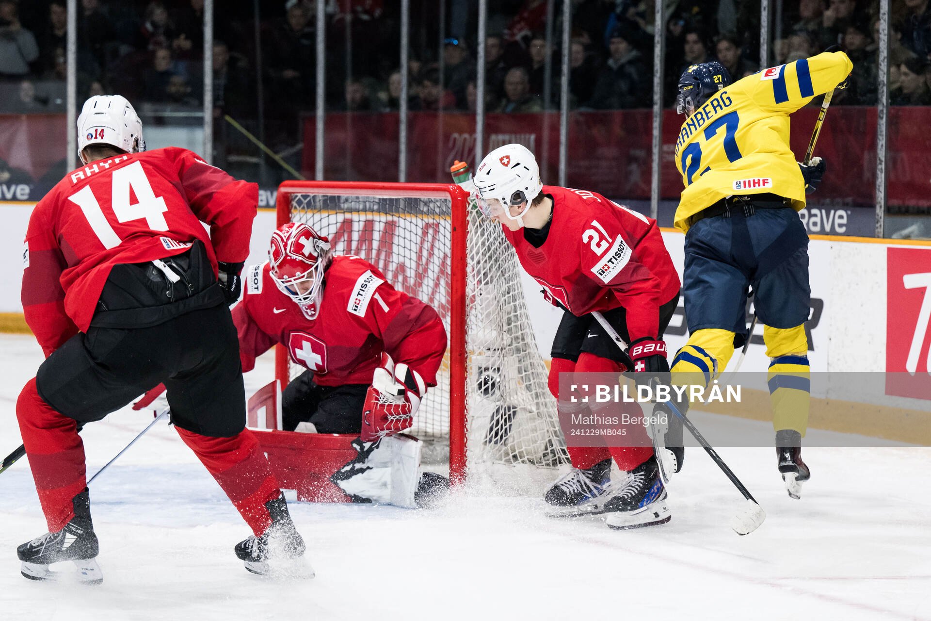 David Granberg of Sweden scores 1-4 behind goaltender