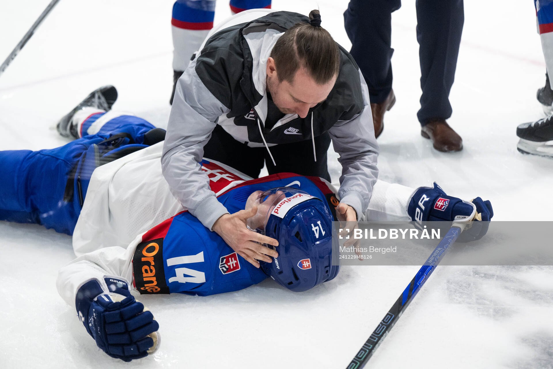 Miroslav Satan of Slovakia receives medical attention