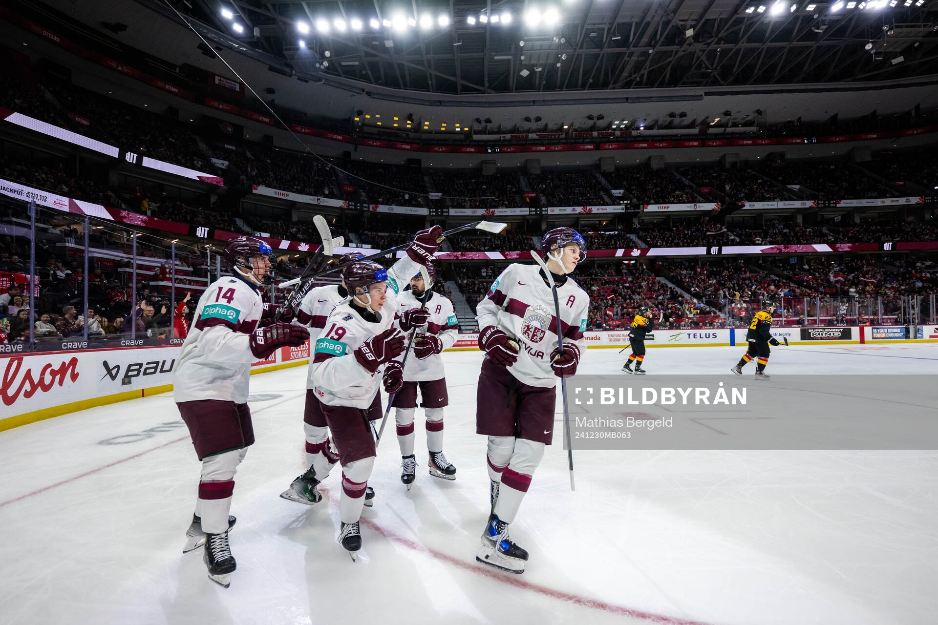 Eriks Mateiko of Latvia celebrates with team mates