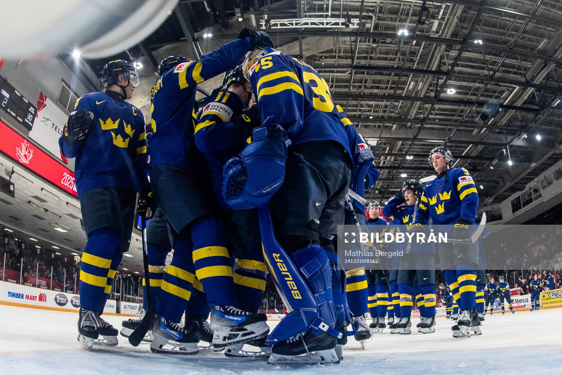 Goaltender Melker Thelin of Sweden celebrates with team