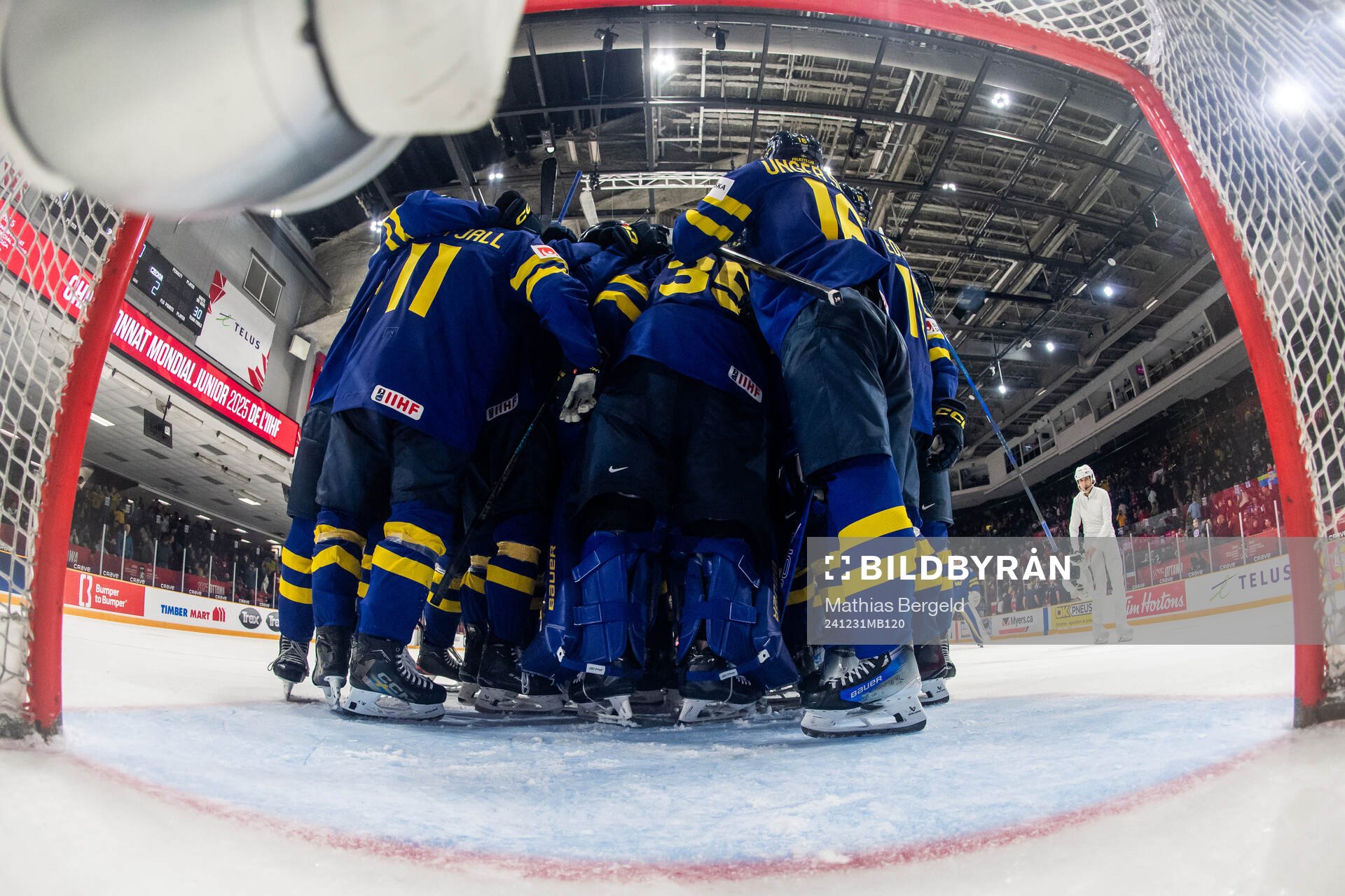 Goaltender Melker Thelin of Sweden celebrates with team