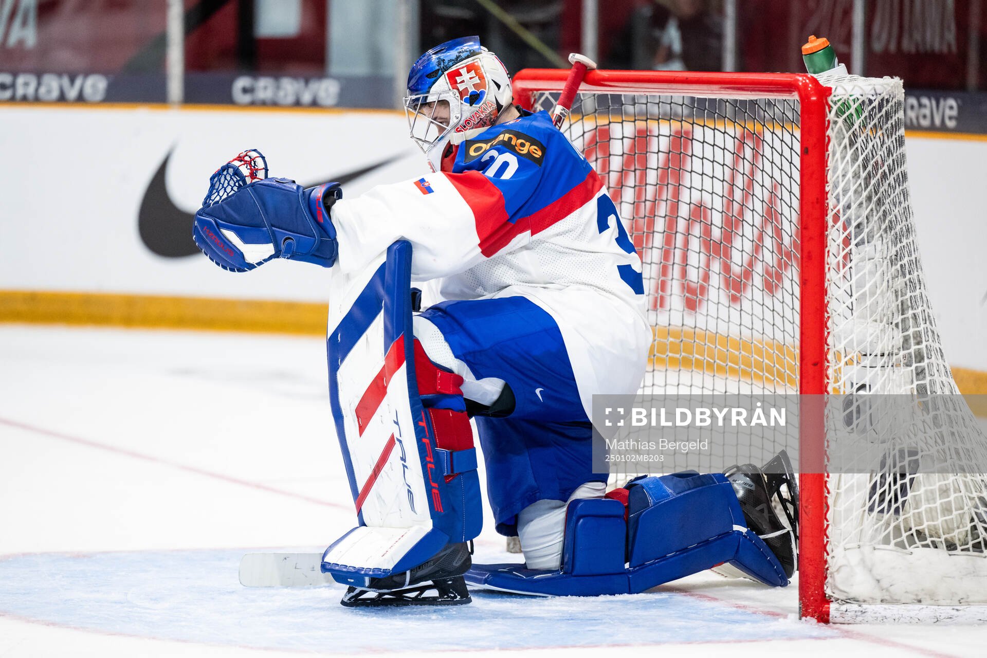 Goaltender Samuel Urban of Slovakia looks dejected