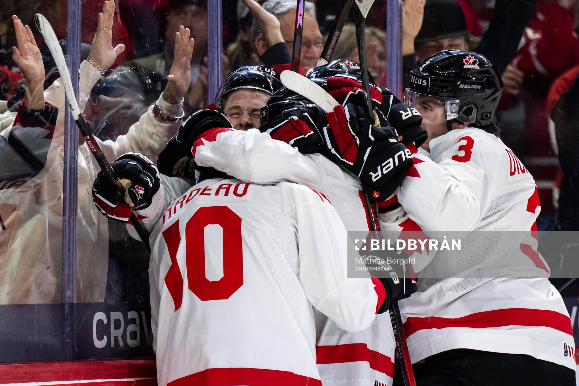 Bradly Nadeau of Canada celebrates with team mates