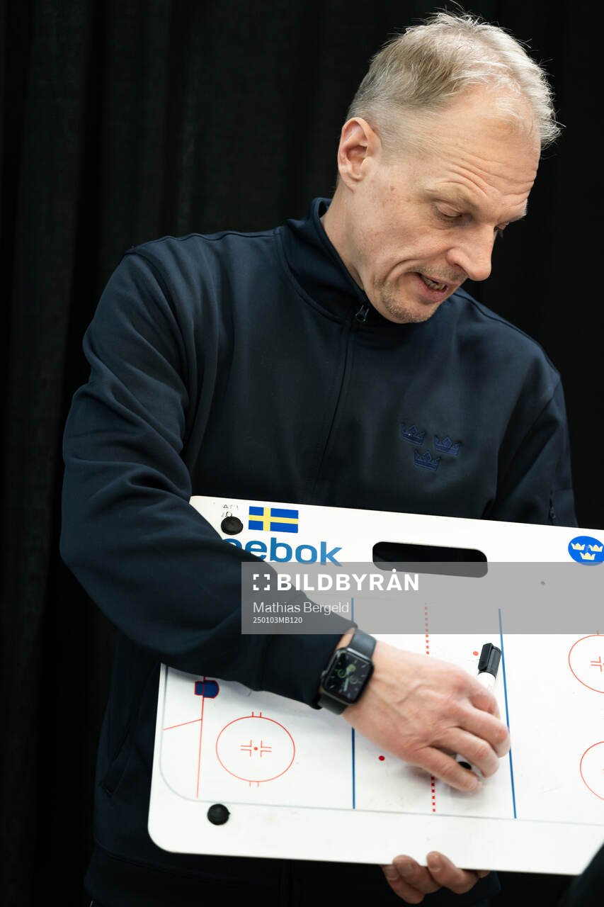 Head coach Magnus Hävelid of Sweden is interviewed holding