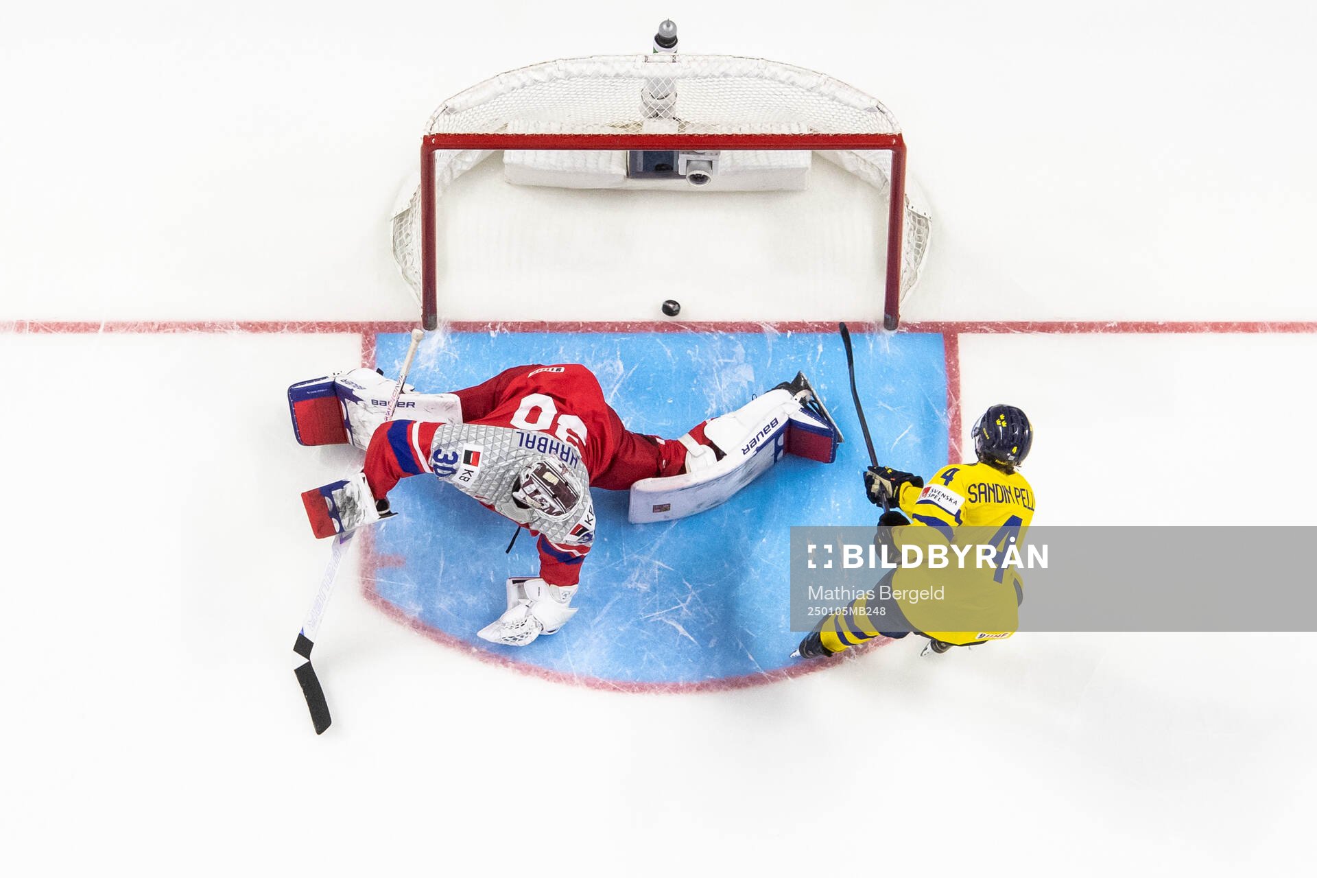 Axel Sandin-Pellikka of Sweden scores