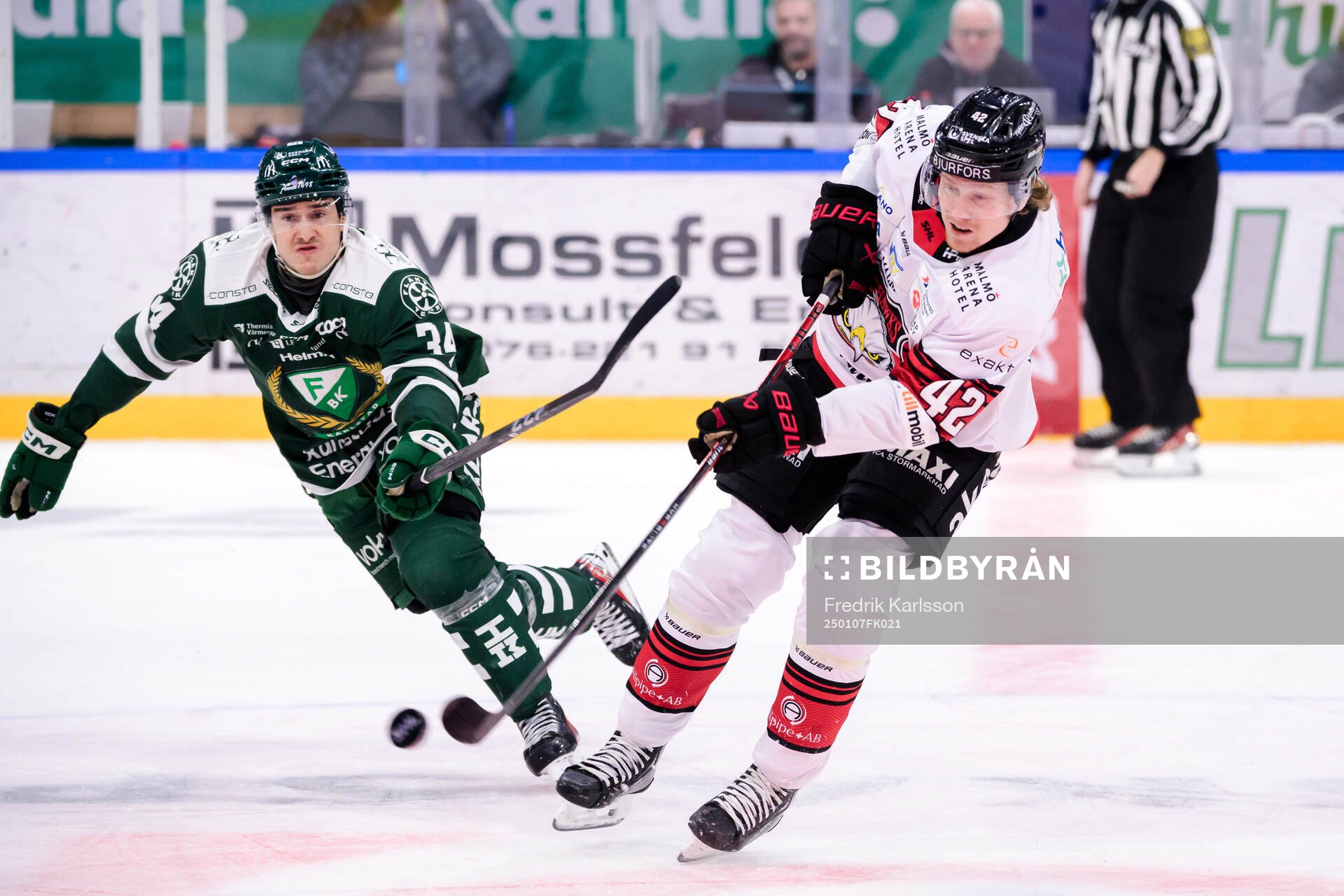 Färjestads Michael Lindqvist och Malmö Redhawks Robin Salo