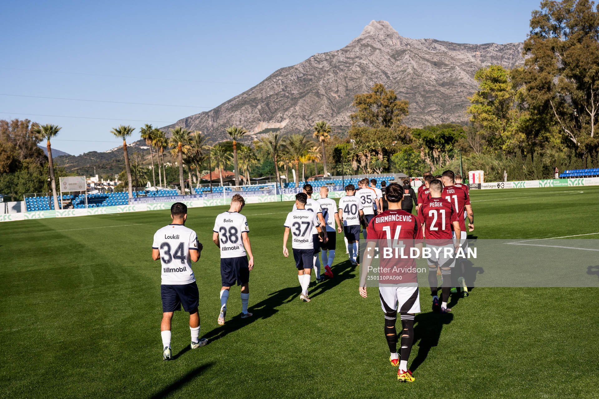 The players entering the pitch