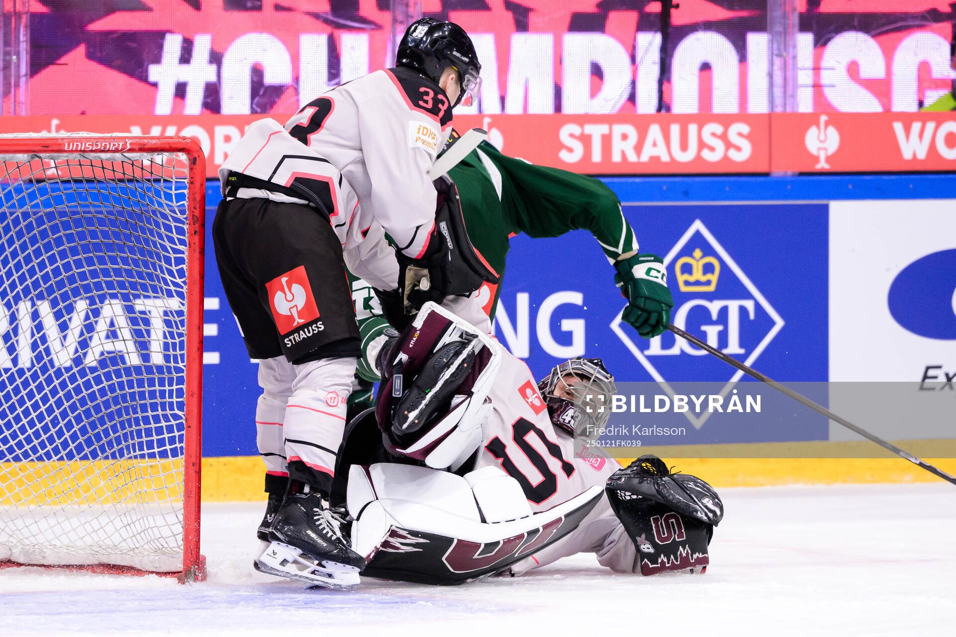 Tomas Tomek of Sparta Prague and goaltender Jakub Kovar of