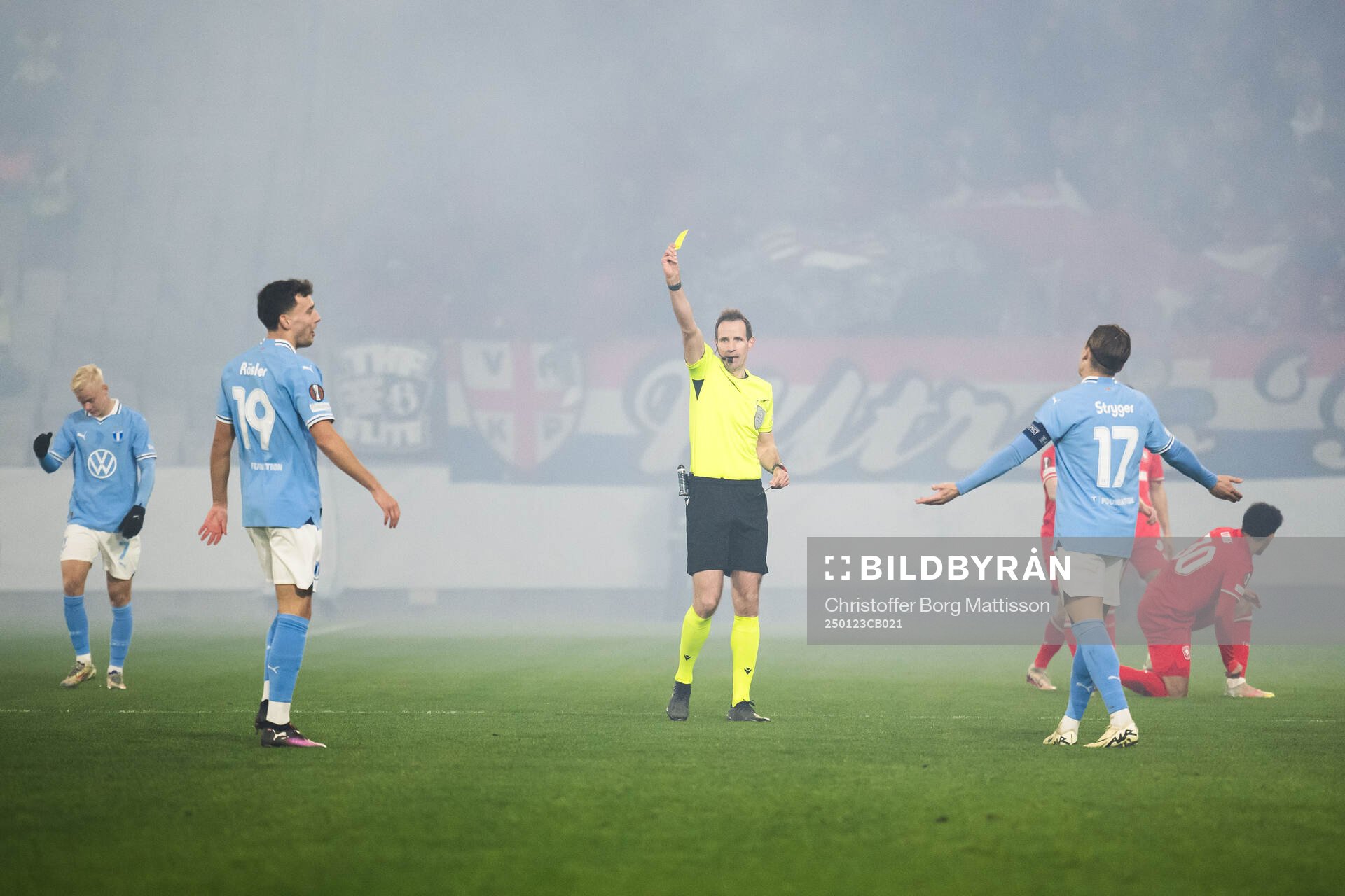 Colin Rösler of Malmö FF receives a yellow card by