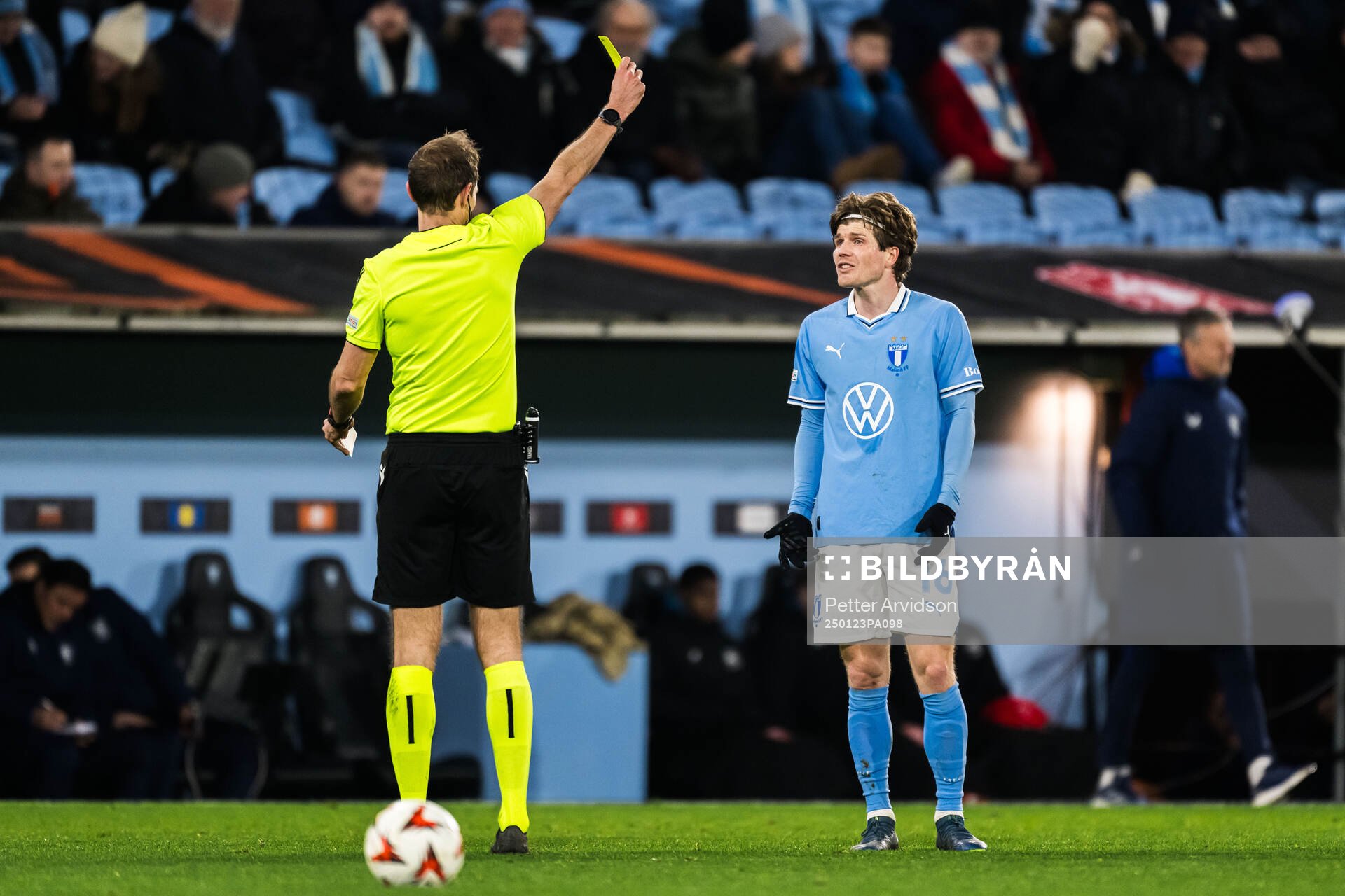 Oliver Berg of Malmö FF receives a yellow card by Referee