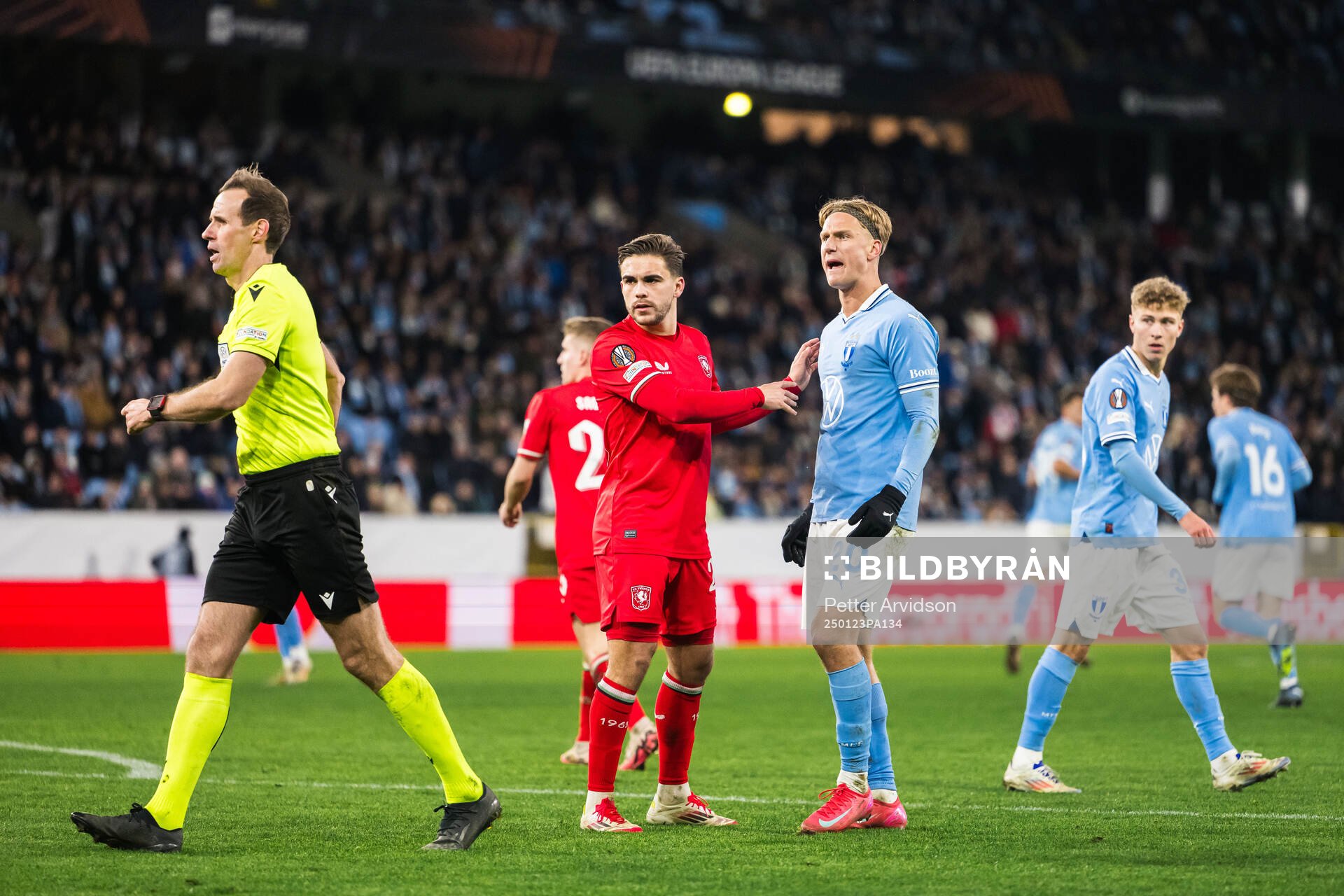 Bart Van Rooij of Twente, Referee Sascha Stegemann and Erik