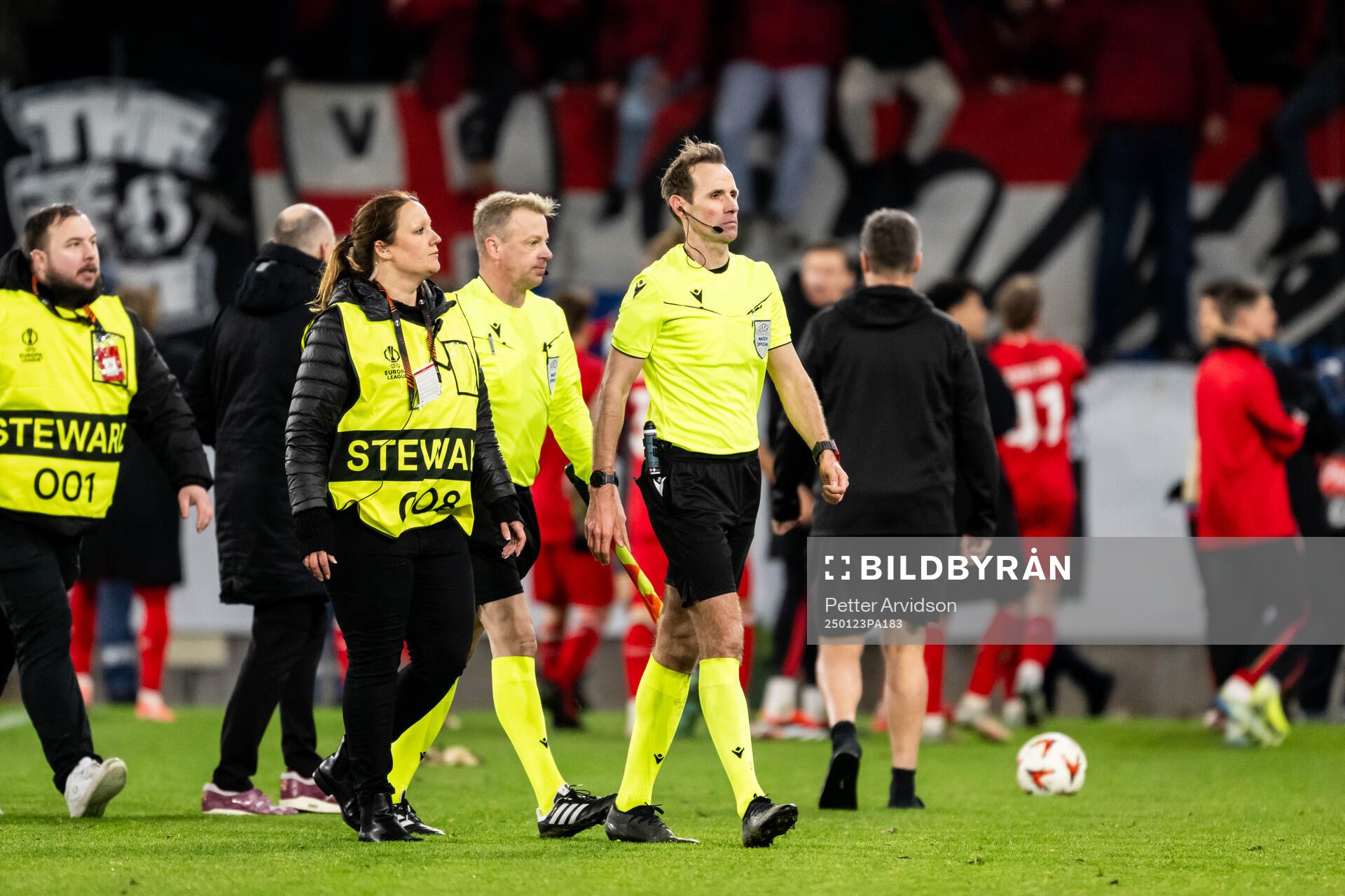 Referee Sascha Stegemann is being escorted of the pitch