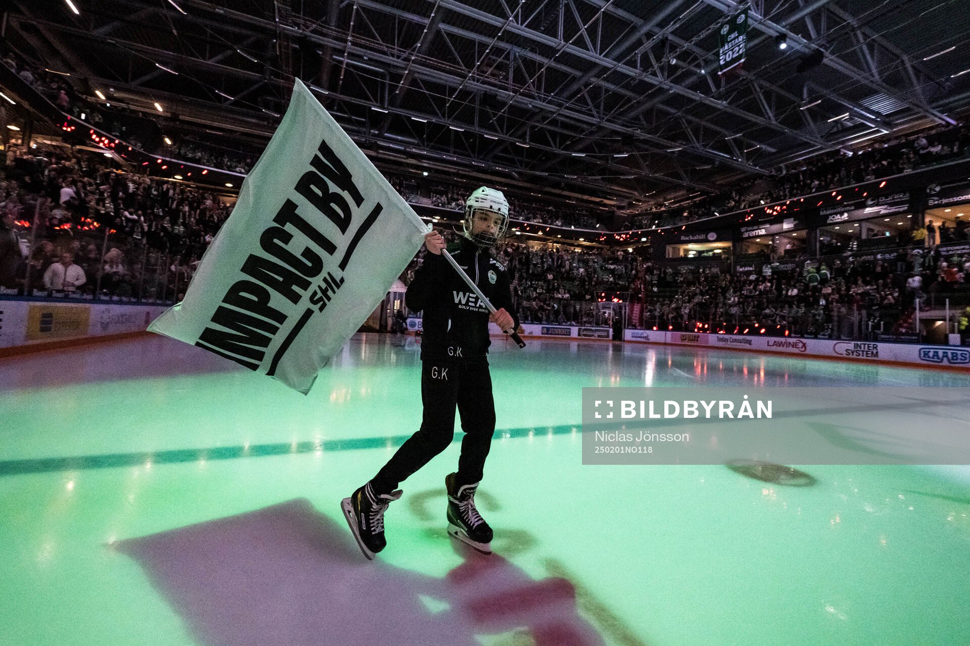 Flagga med texten ”Impact by SHL”