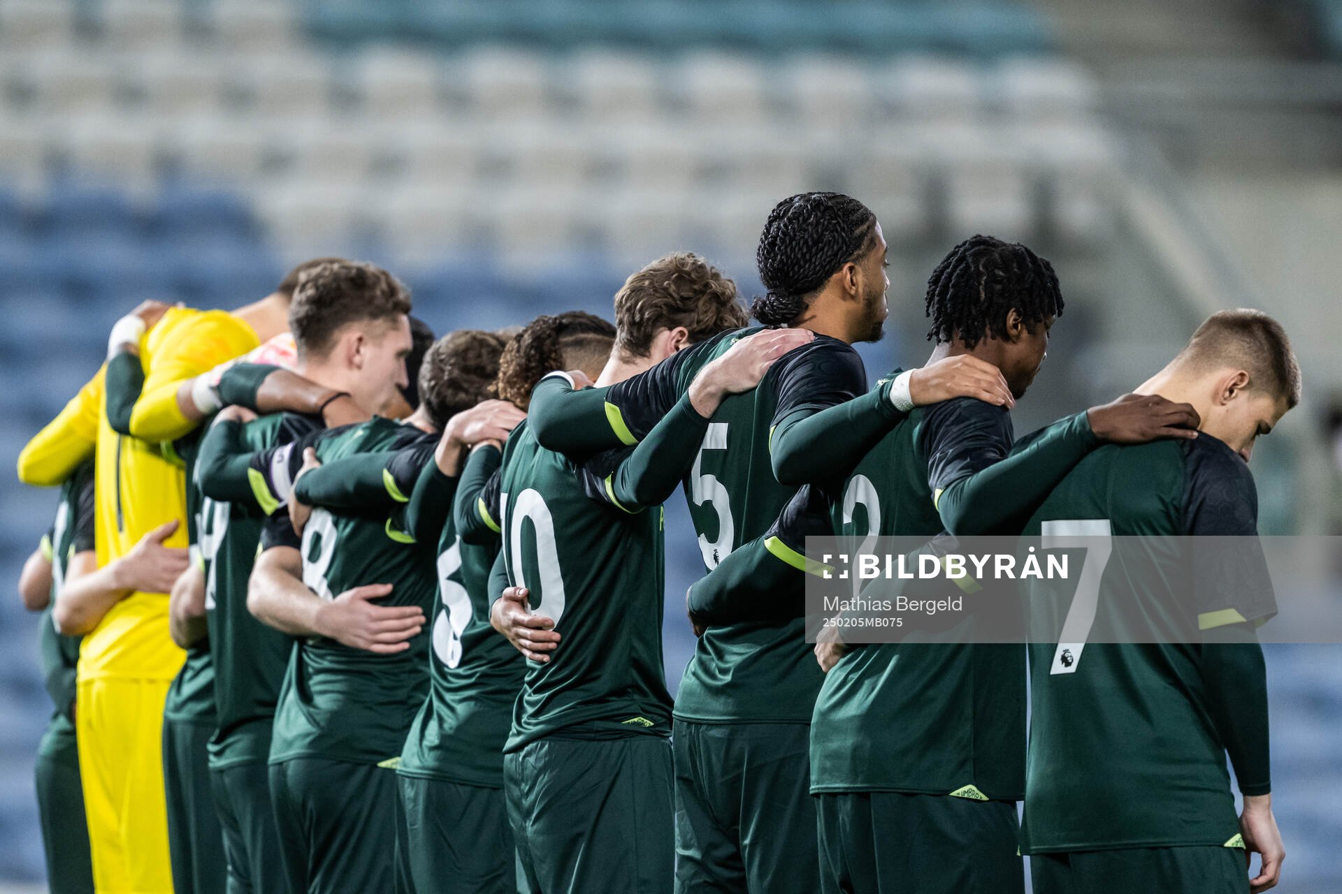 Players of Brentford B in a minute of silence to honor the