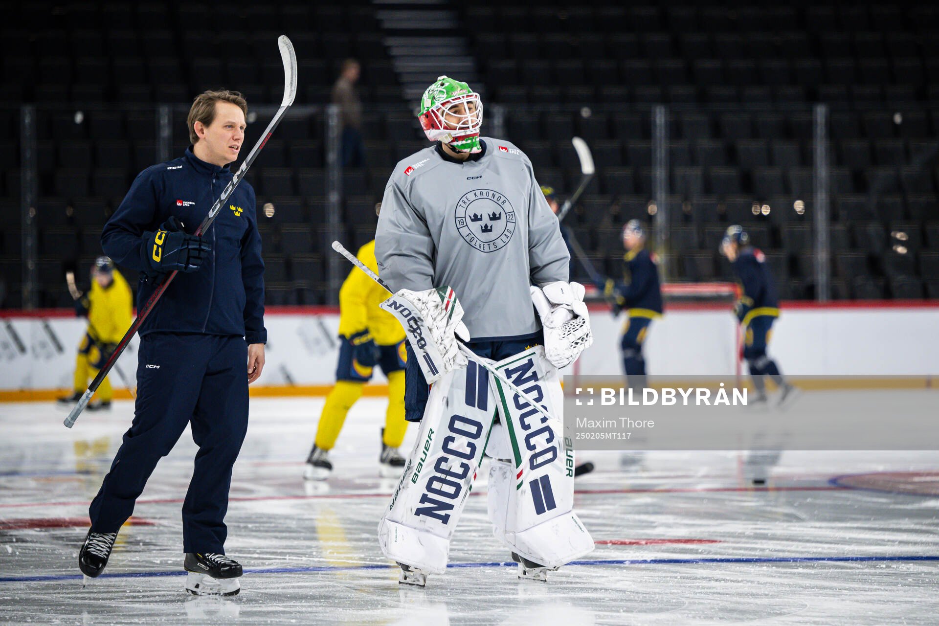 Goaltender coach Viktor Alm and goaltender Linus