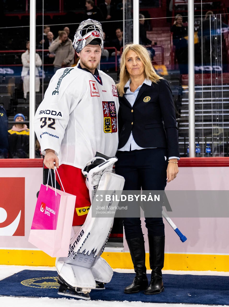 Goaltender Josef Korenar of Czech Republic is awarded