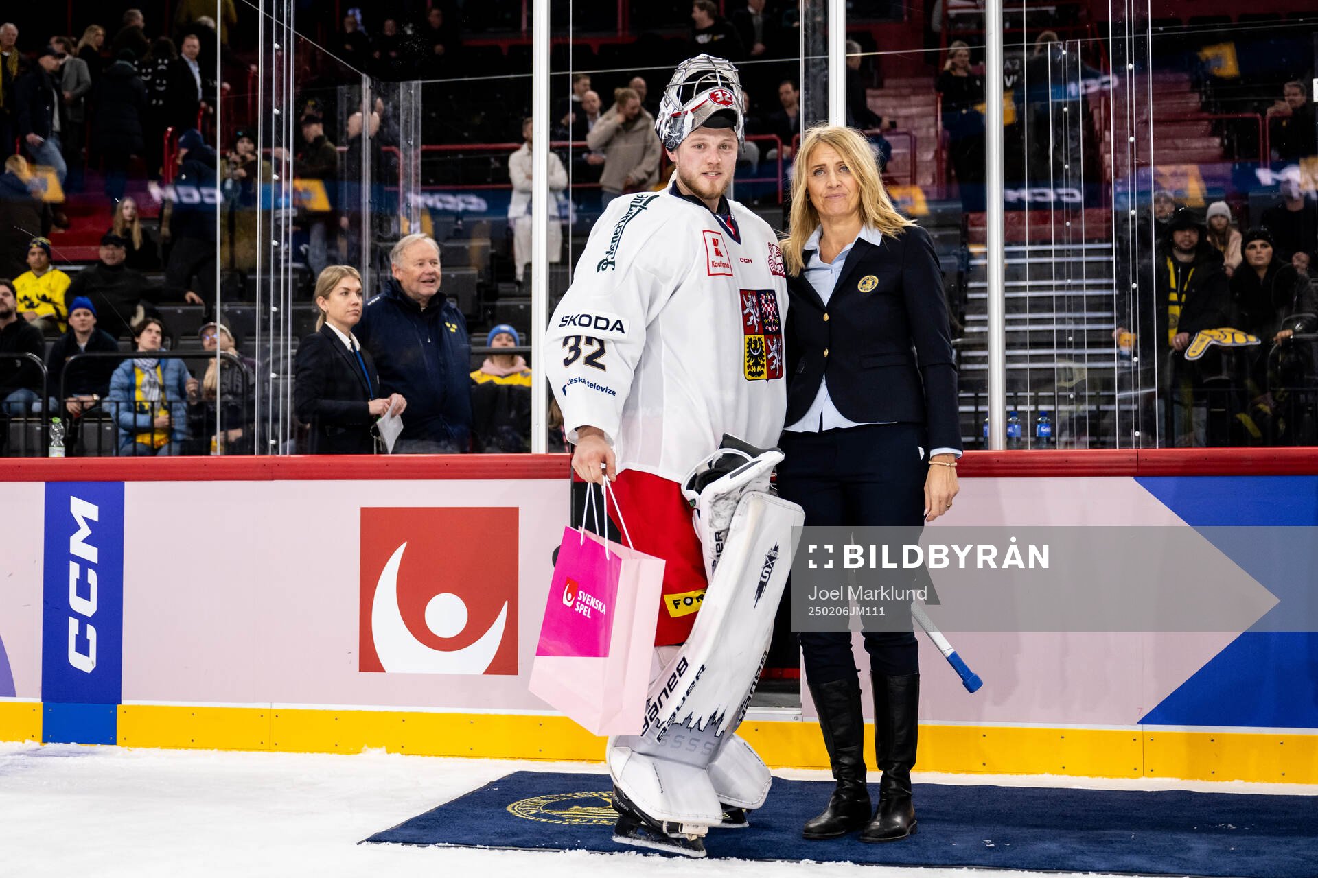 Goaltender Josef Korenar of Czech Republic is awarded