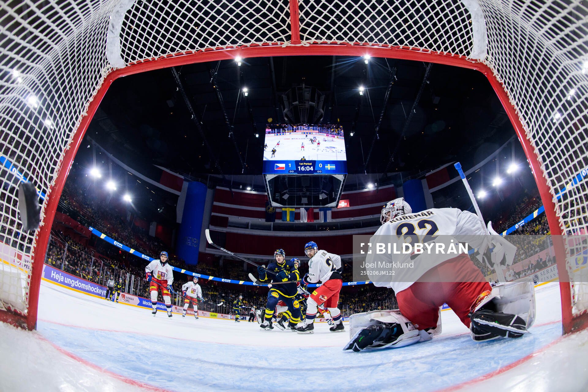 Sebastian Hartmann of Sweden scores 1-1 behind goaltender