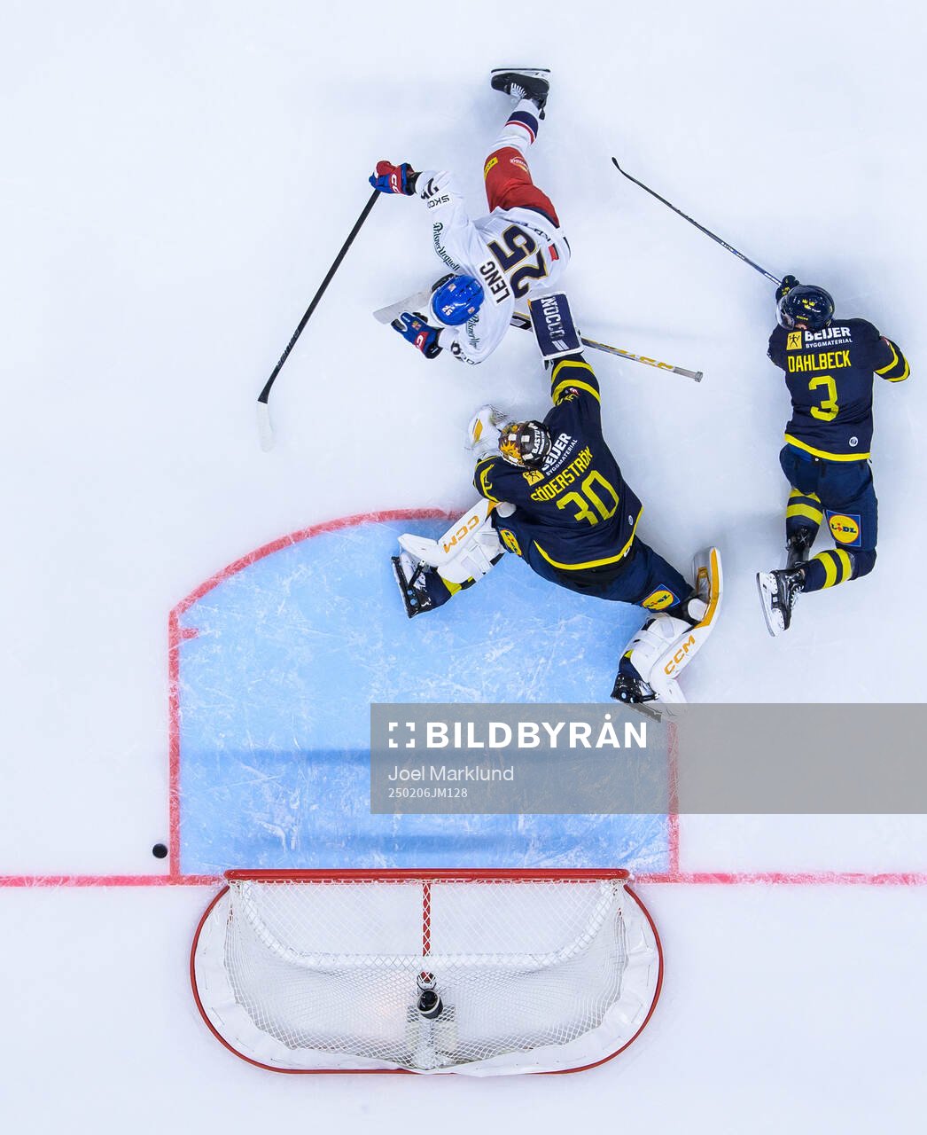 Radan Lenc of Czech Republic challenges goaltender Linus