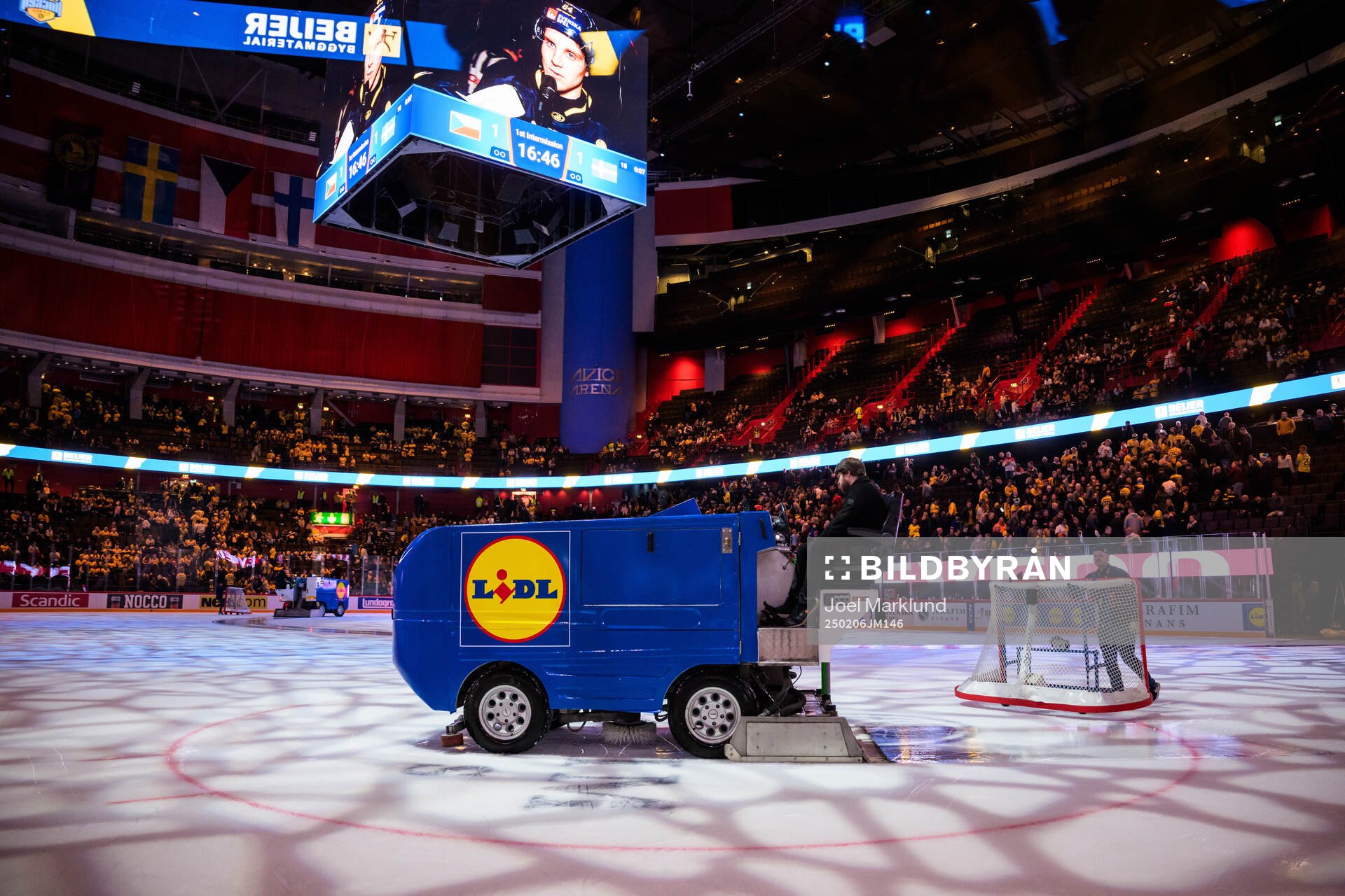 Zambonis preparing the ice