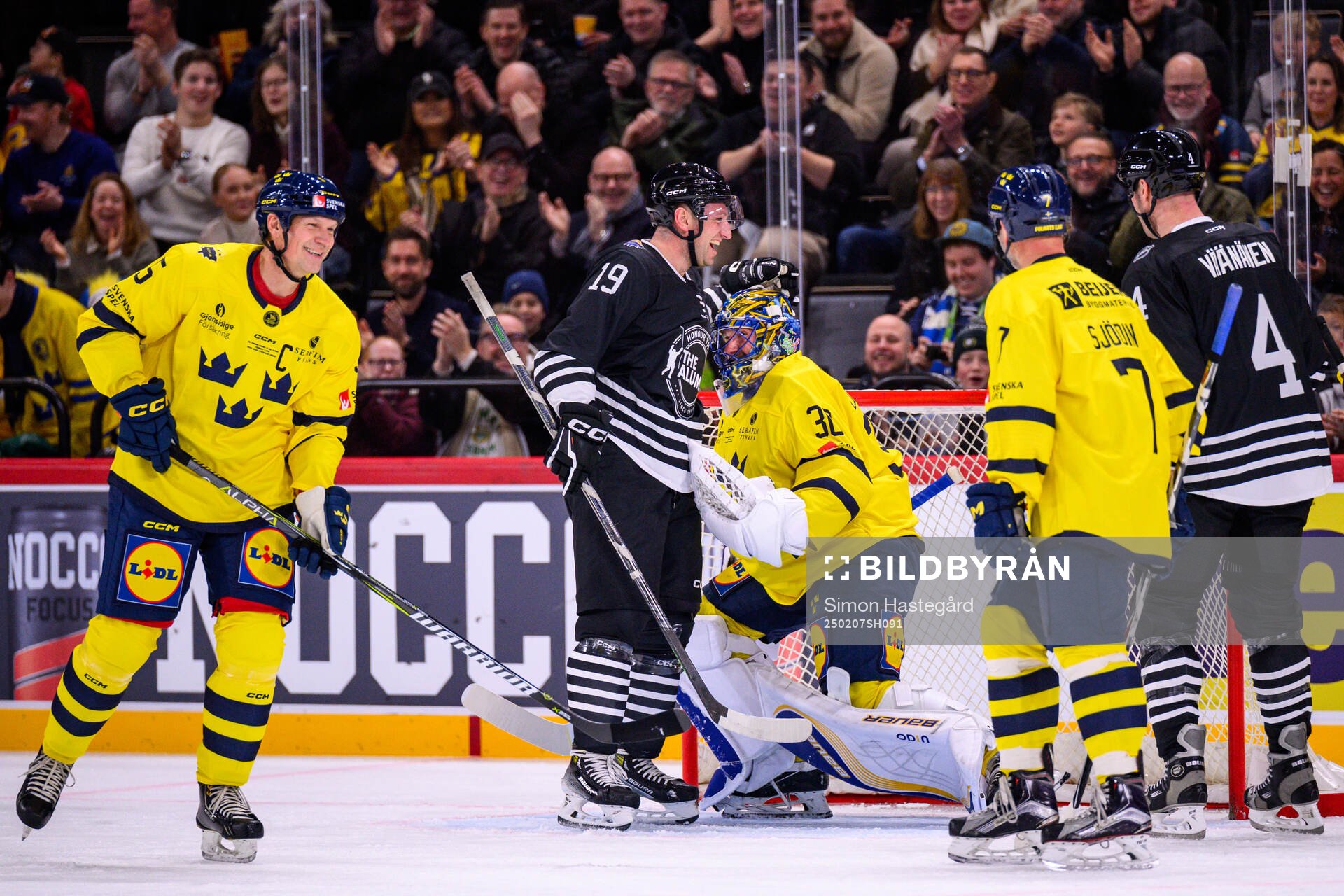 Jiri Tlusty  of NHL Alumni with Mats Sundin and goaltender