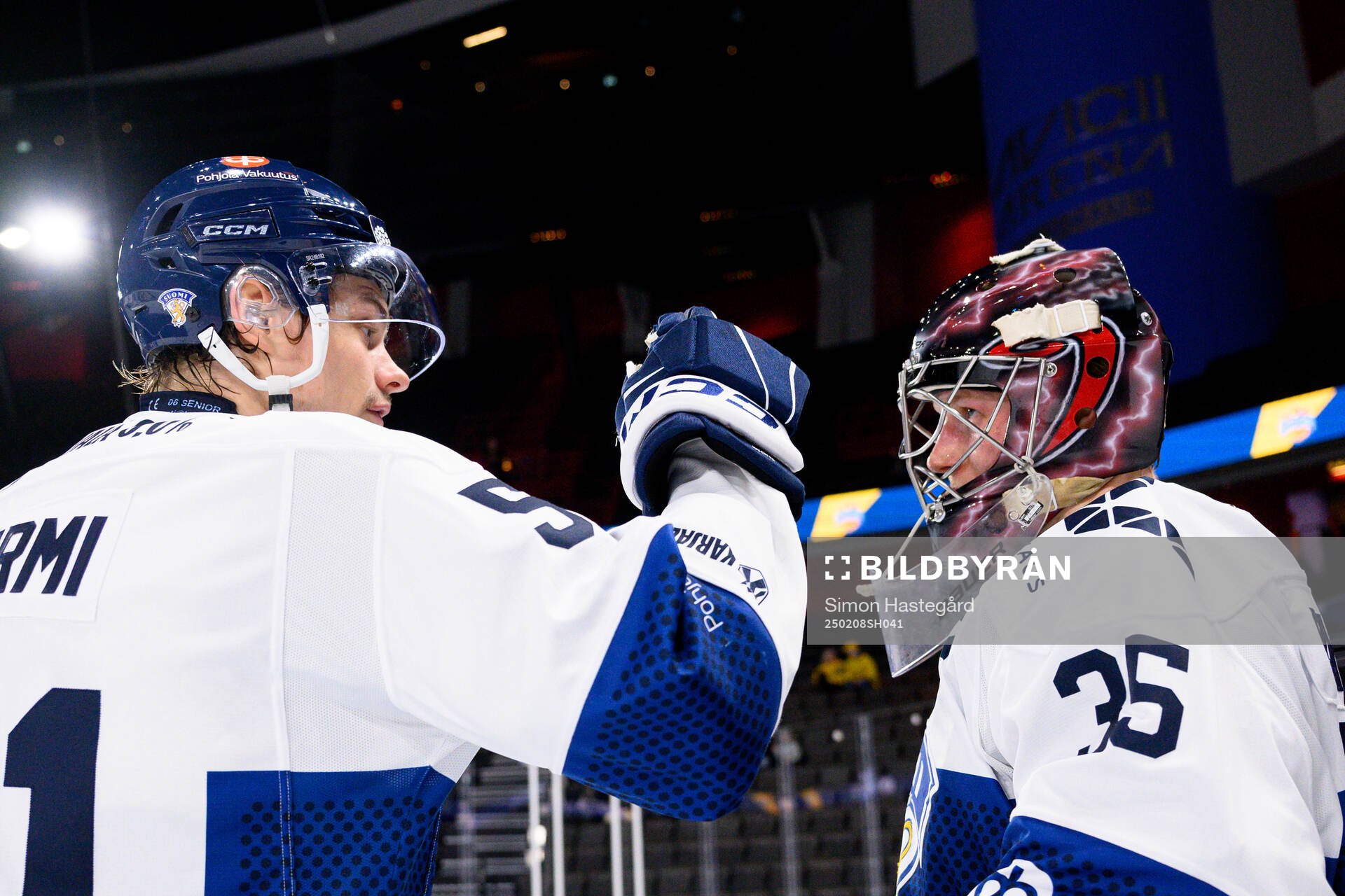 Markus Nurmi and goalkeeper Oskari Salminen of Finland