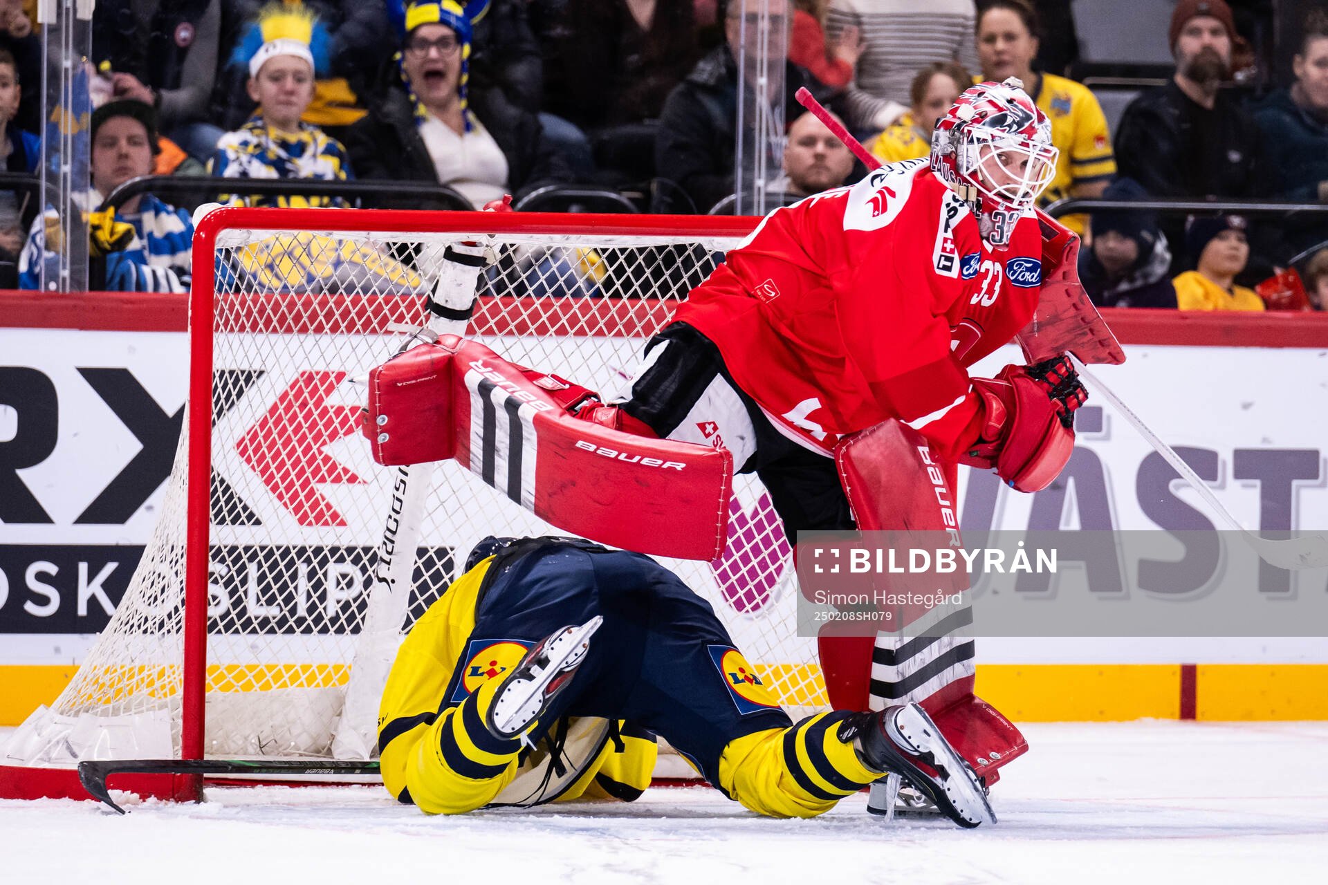 Dennis Everberg of Sweden and goaltender Kevin Pasche of