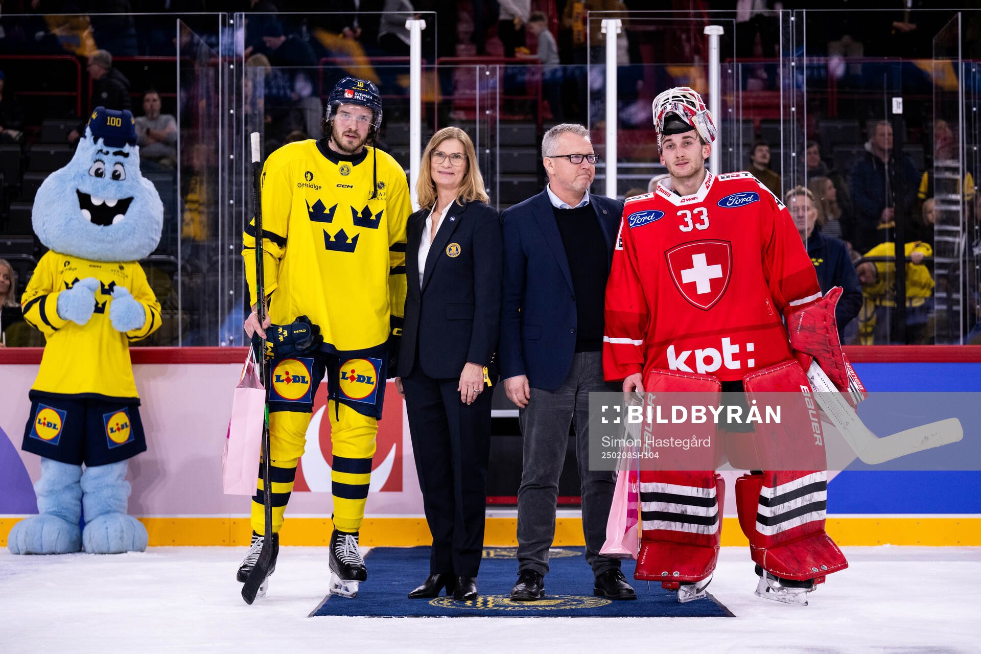 Dennis Everberg of Sweden and goaltender Kevin Pasche of