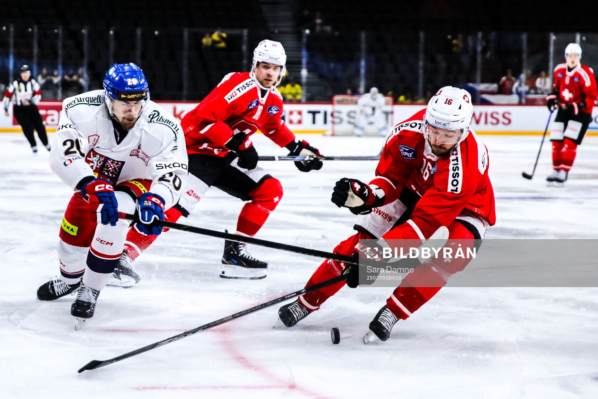 Michal Kunc of Czech Republic and David Aebischer of