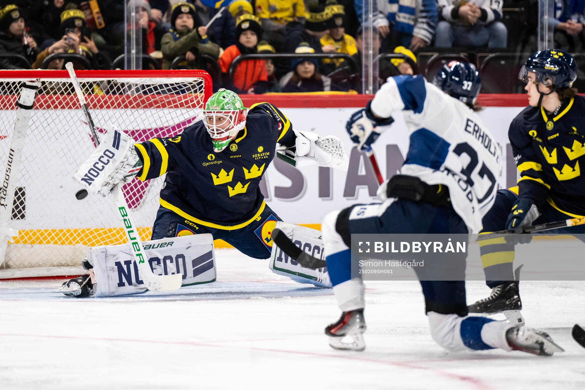 Eemil Erholtz of Finland scores the 0-1 goal behind